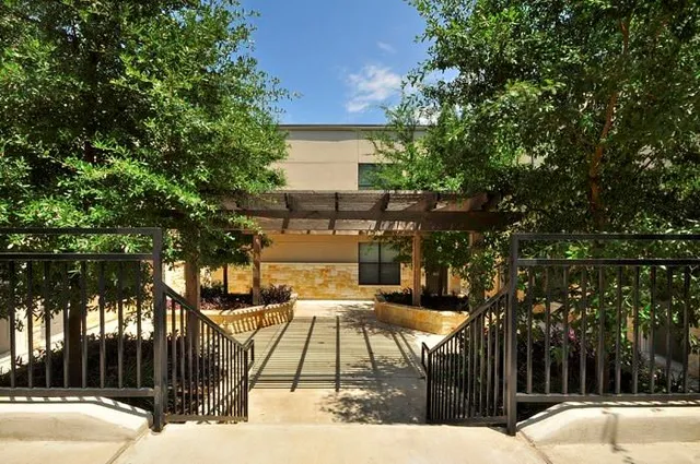 a view of backyard with a patio