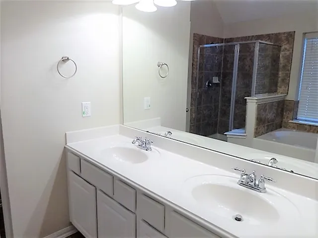 a bathroom with a sink and mirror