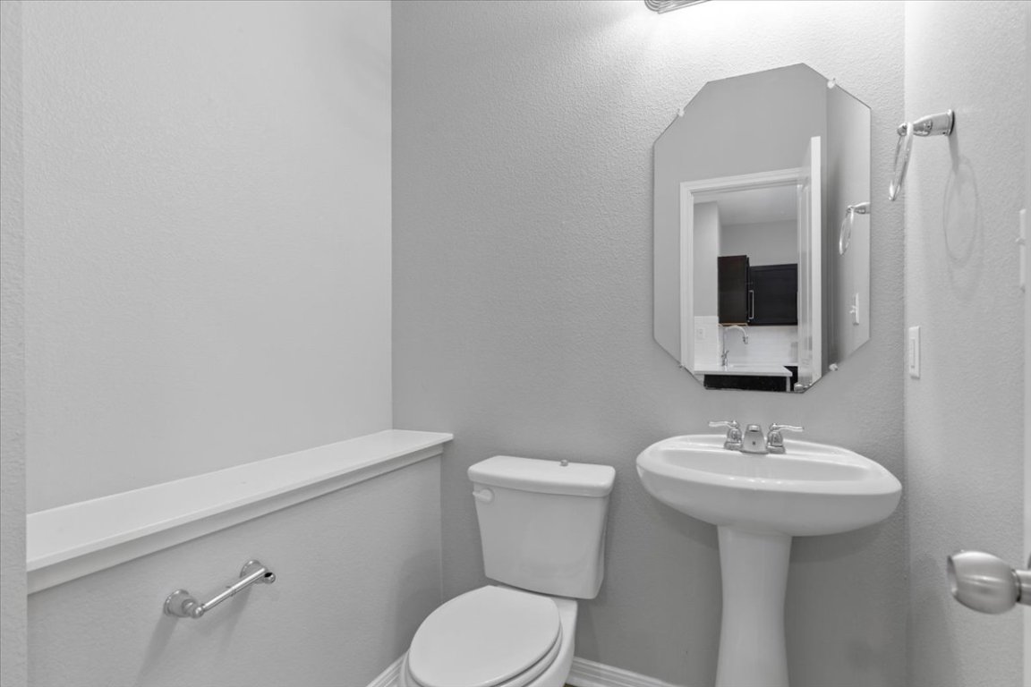 4524 Kind Way, Unit 257 Austin, TX 78725 - Photo 12 of 16 Bathroom with a textured wall