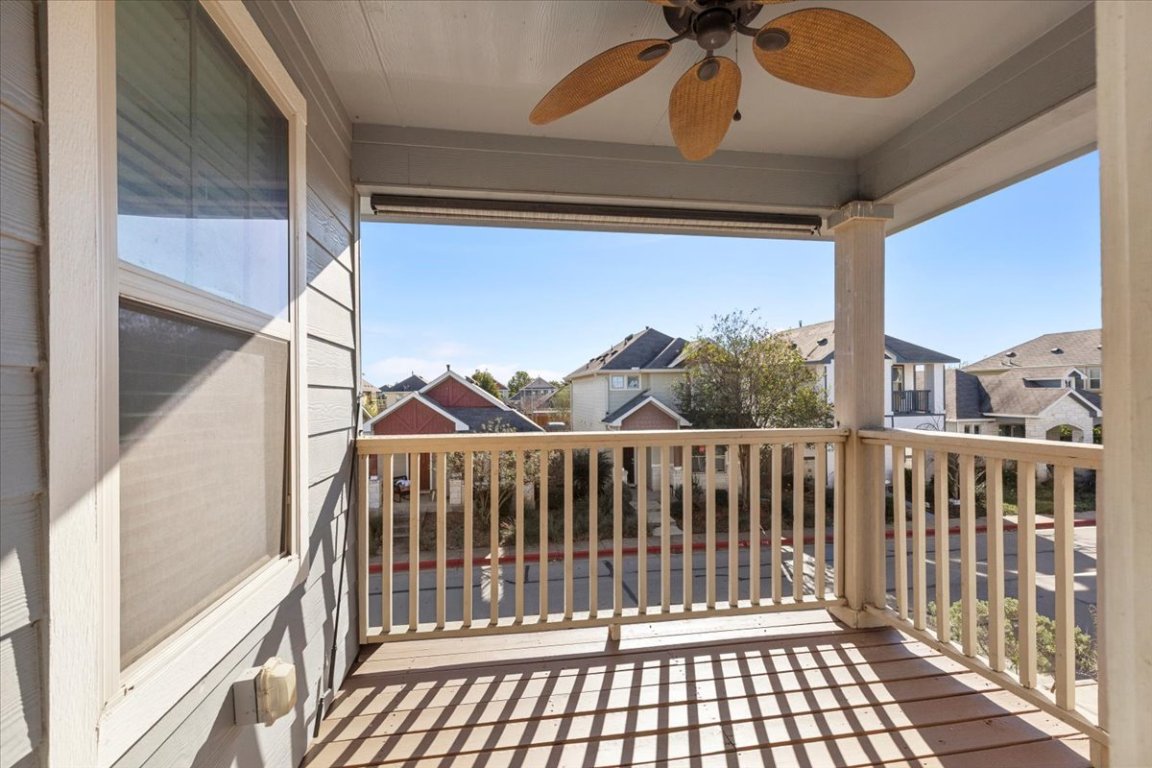 4524 Kind Way, Unit 257 Austin, TX 78725 - Photo 14 of 16 Balcony with a residential view and a ceiling fan