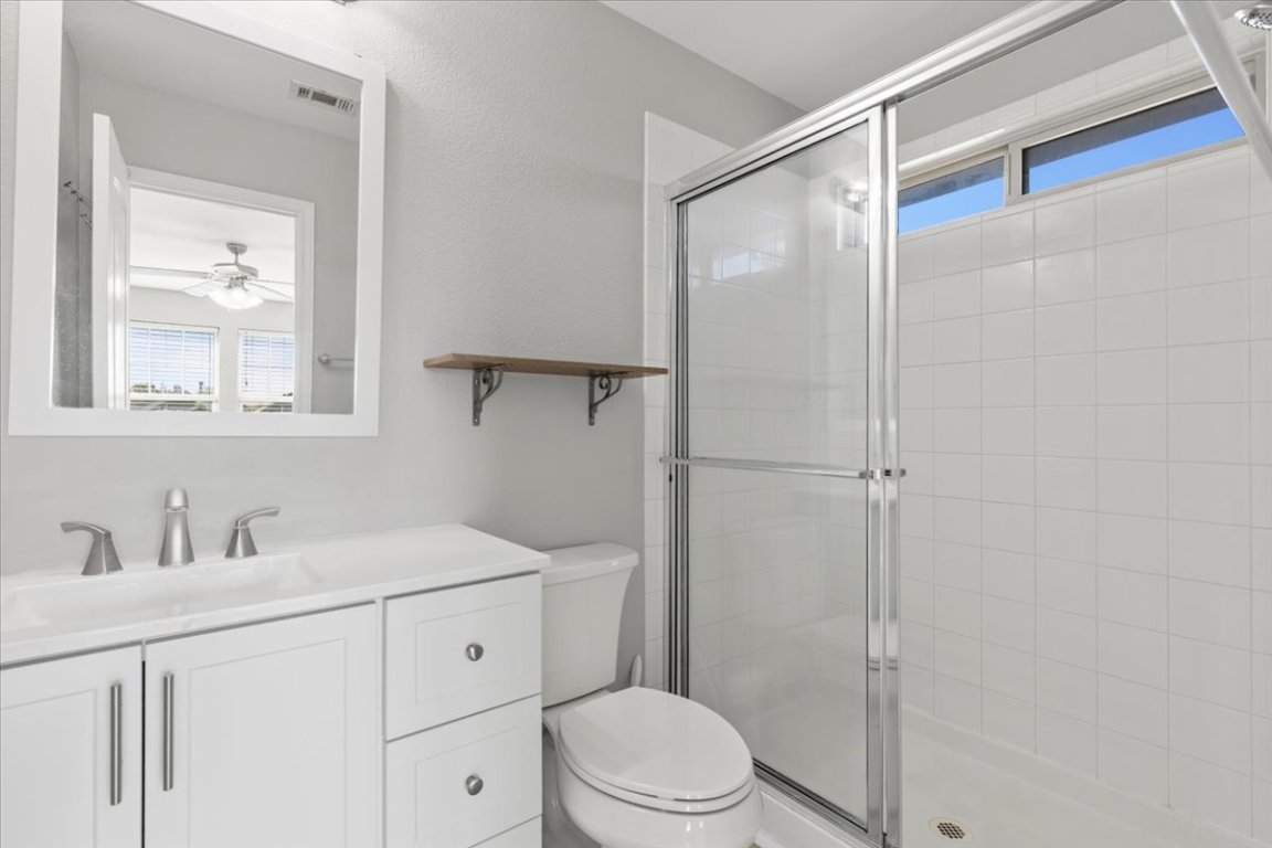 4524 Kind Way, Unit 257 Austin, TX 78725 - Photo 8 of 16 Full bath featuring healthy amount of natural light, vanity, and a stall shower