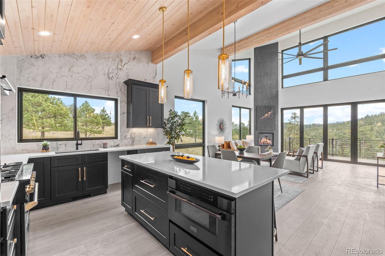 542 Conifer Drive Bailey, CO 80421 - Photo 12 of 47 a kitchen with a stove a sink and cabinets