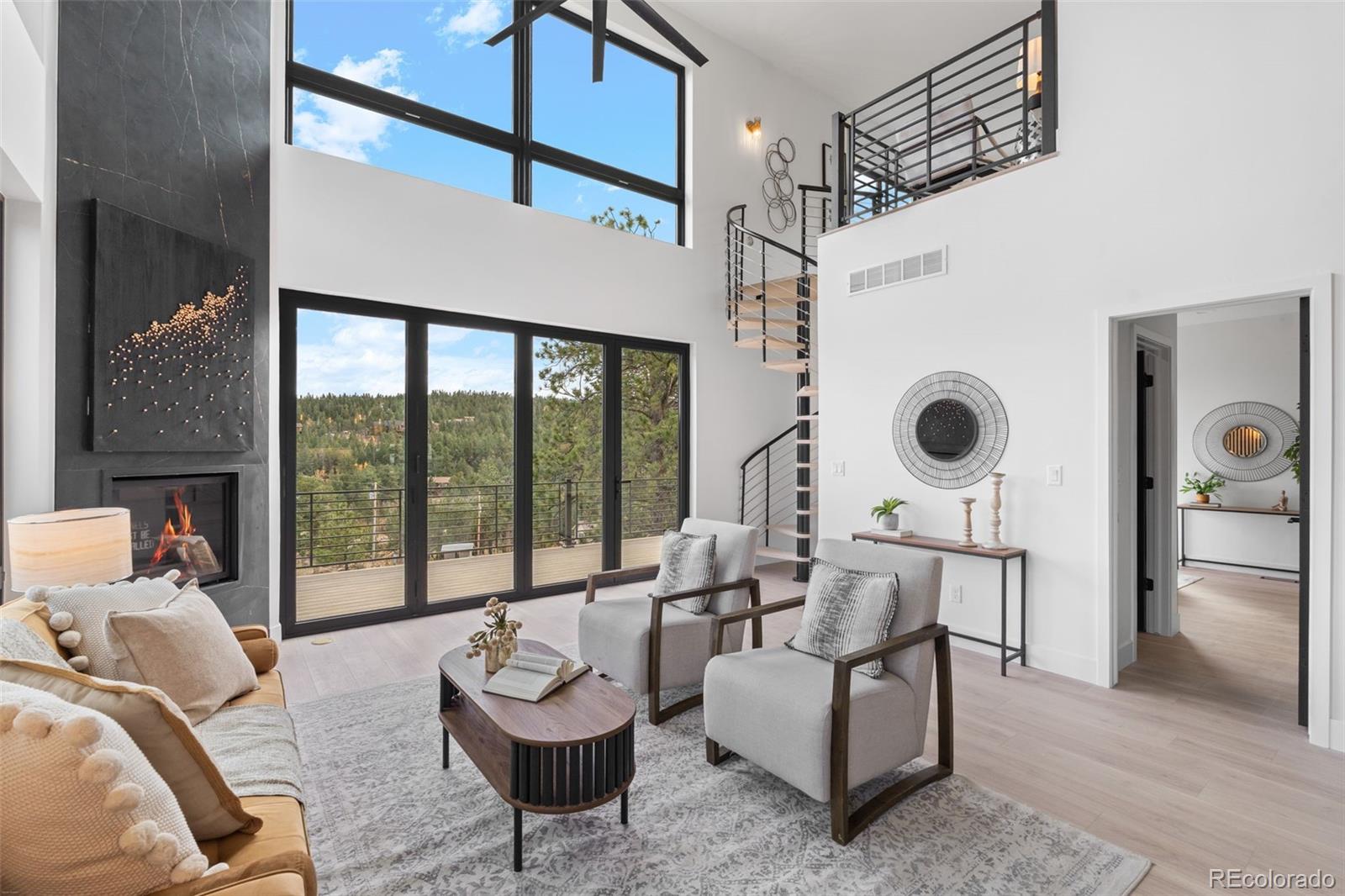 542 Conifer Drive Bailey, CO 80421 - Photo 14 of 47 a living room with furniture and a large window