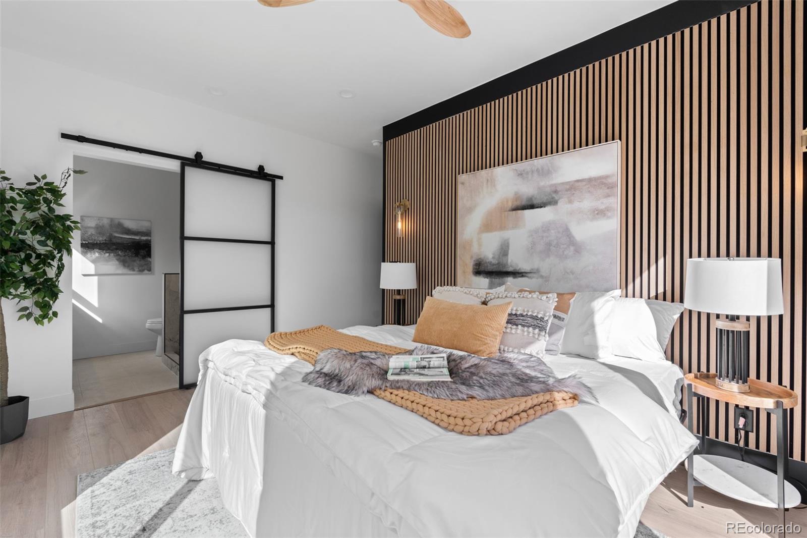 542 Conifer Drive Bailey, CO 80421 - Photo 26 of 47 a bedroom with a bed and a mirror