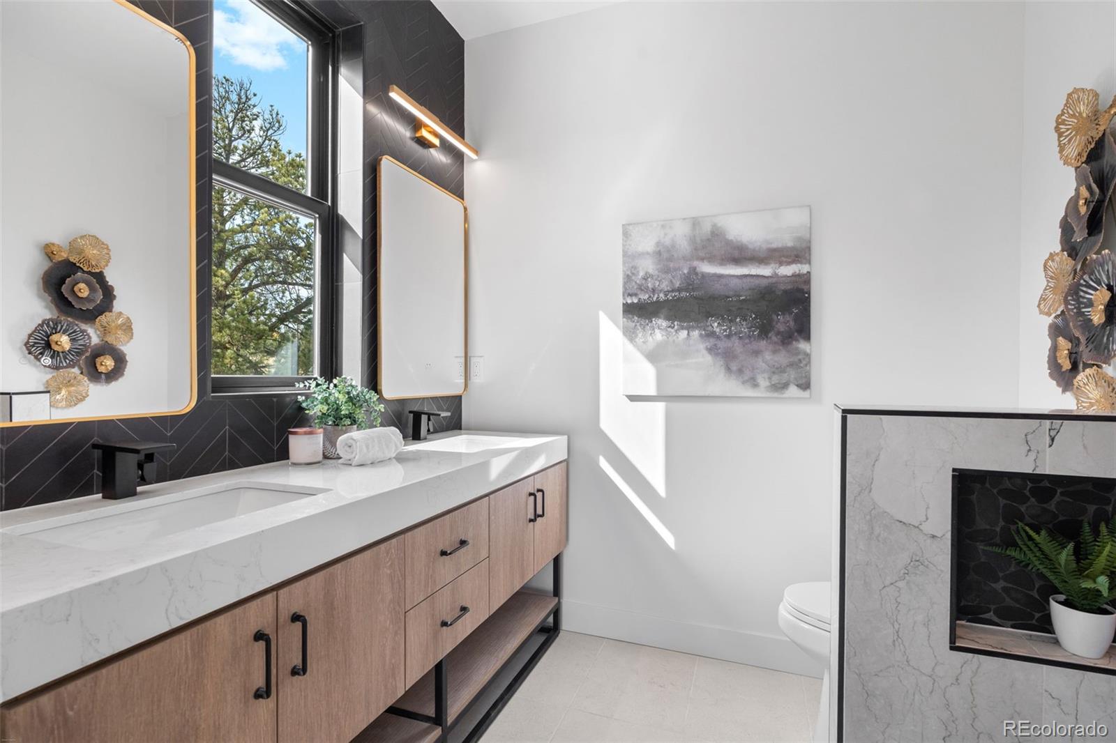 542 Conifer Drive Bailey, CO 80421 - Photo 30 of 47 a bathroom with a double vanity sink and a window