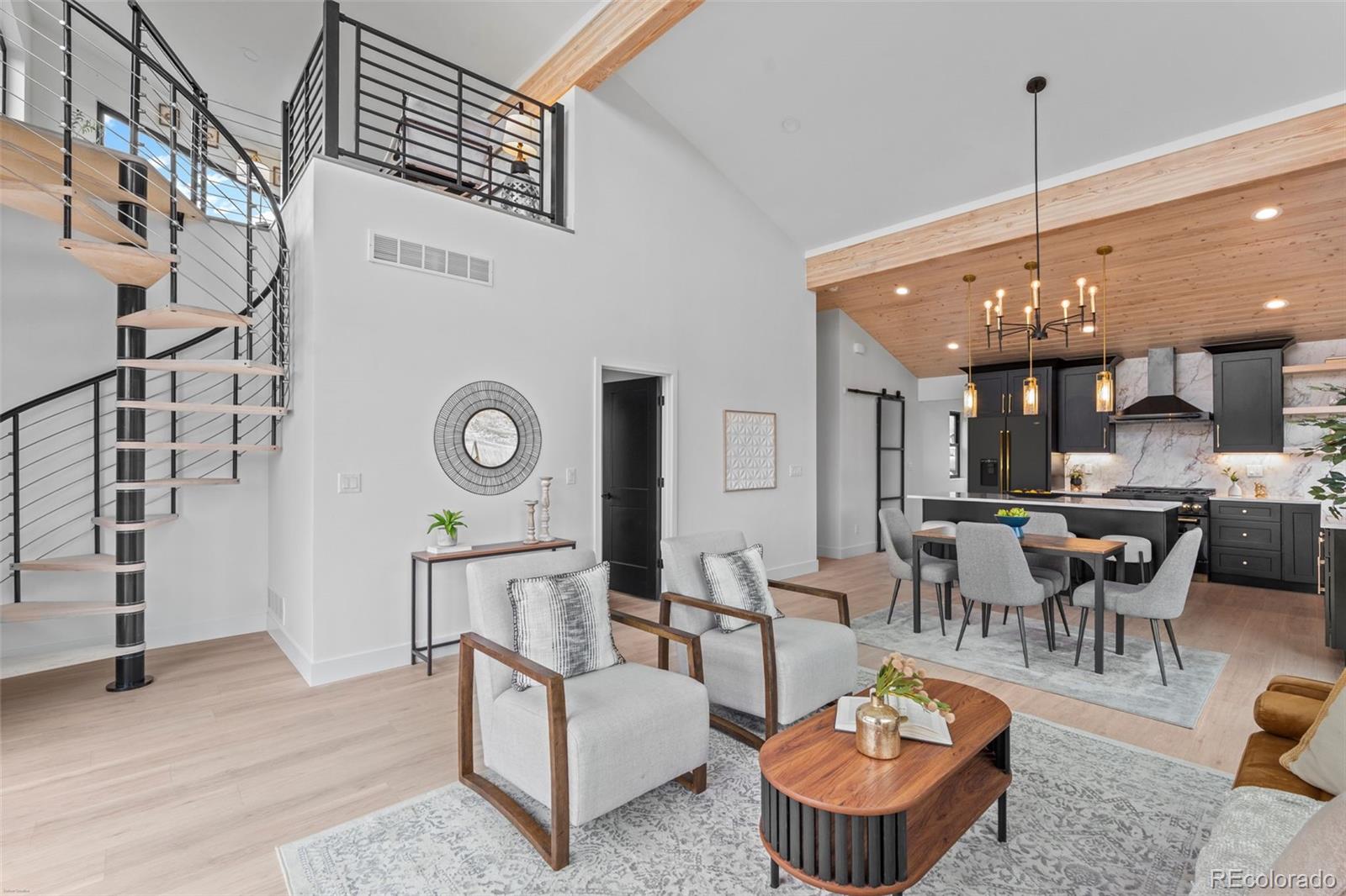 542 Conifer Drive Bailey, CO 80421 - Photo 32 of 47 a living room with furniture a rug and white walls
