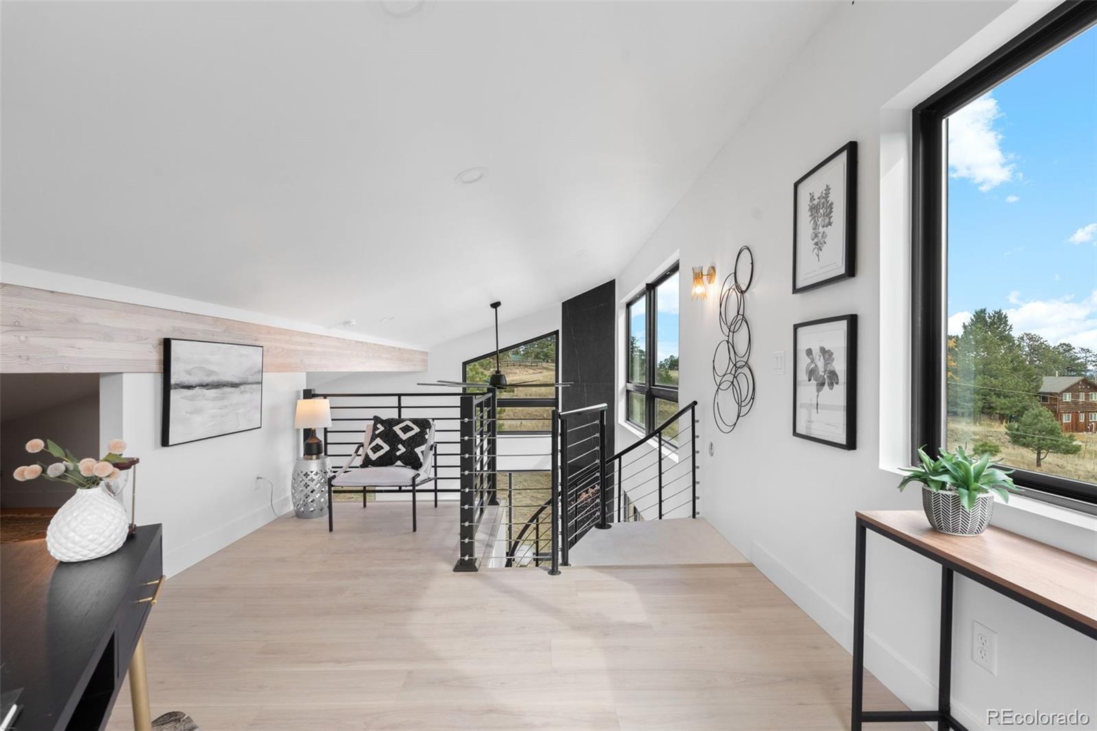 542 Conifer Drive Bailey, CO 80421 - Photo 33 of 47 a view of a livingroom with furniture and a flat screen tv