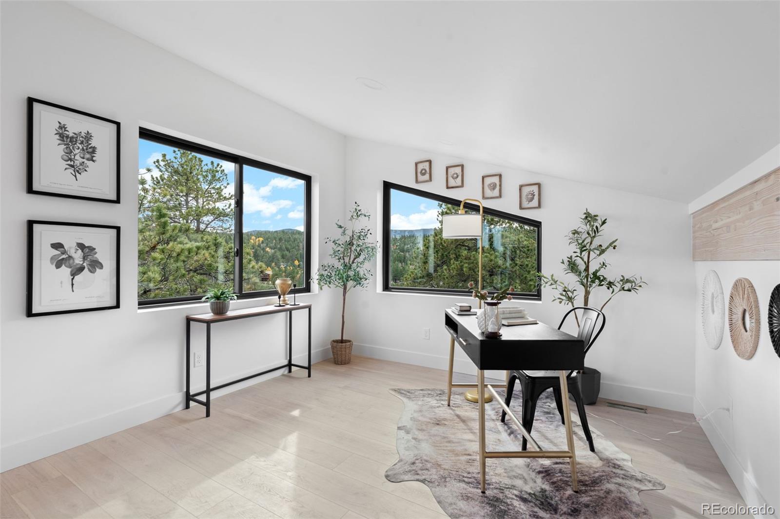 542 Conifer Drive Bailey, CO 80421 - Photo 34 of 47 a living room with furniture and a large window