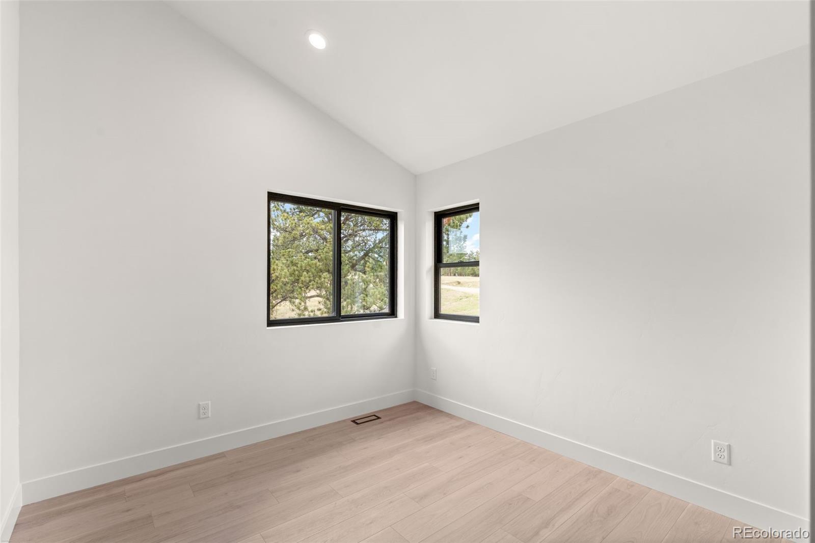 542 Conifer Drive Bailey, CO 80421 - Photo 38 of 47 an empty room with windows