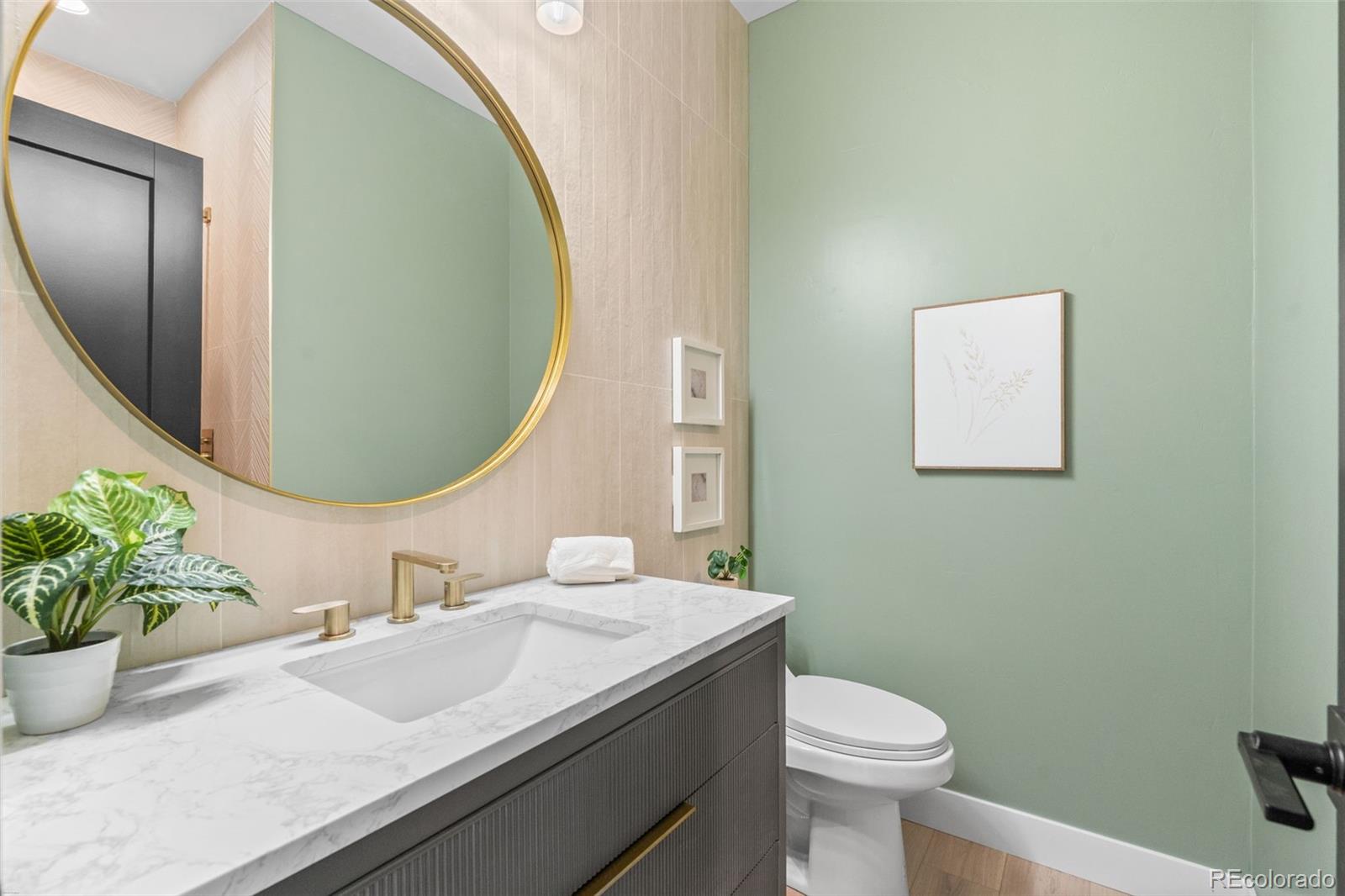 542 Conifer Drive Bailey, CO 80421 - Photo 39 of 47 a bathroom with a granite countertop toilet sink and mirror