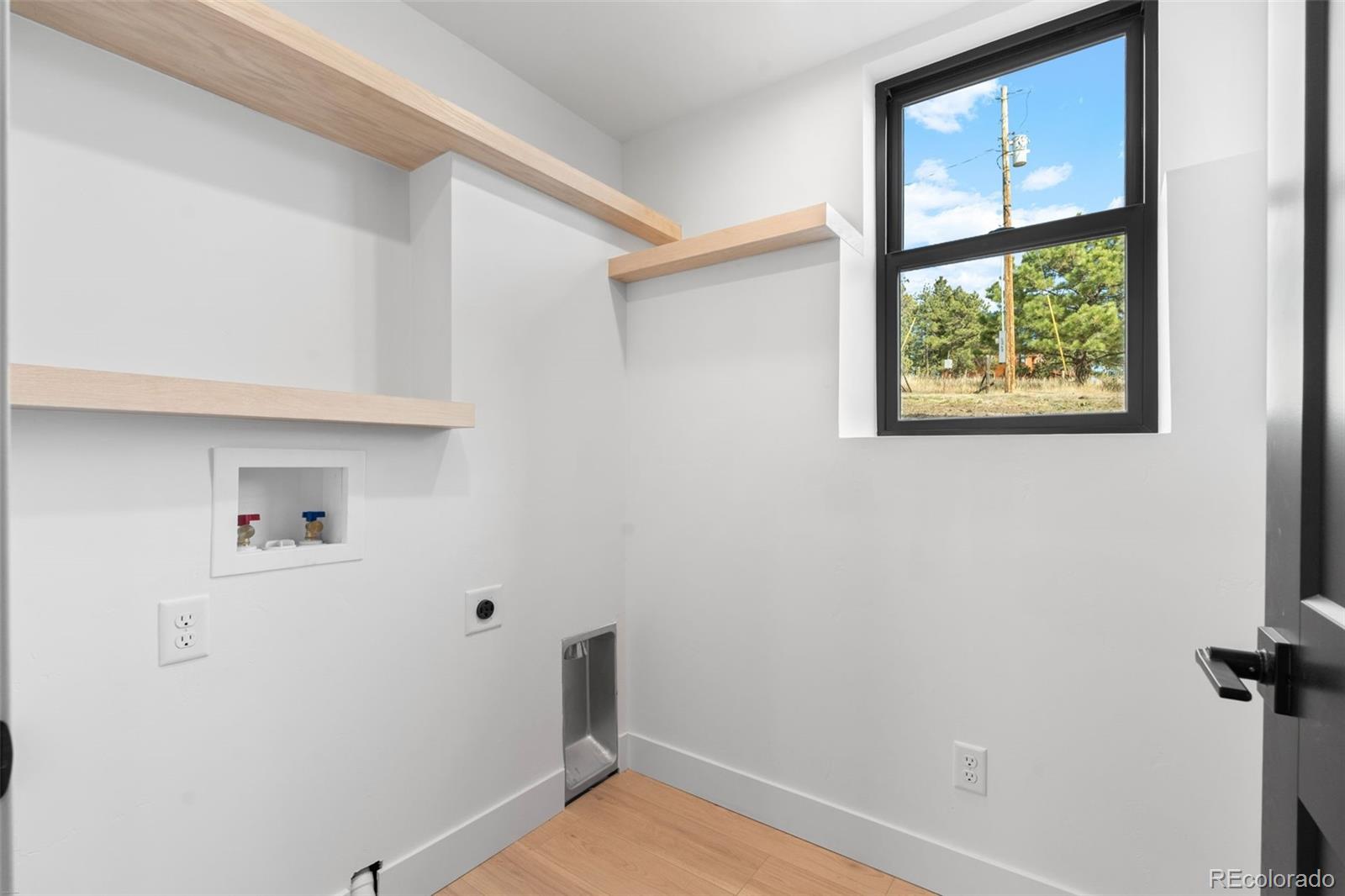 542 Conifer Drive Bailey, CO 80421 - Photo 46 of 47 a view of room with window and wooden floor