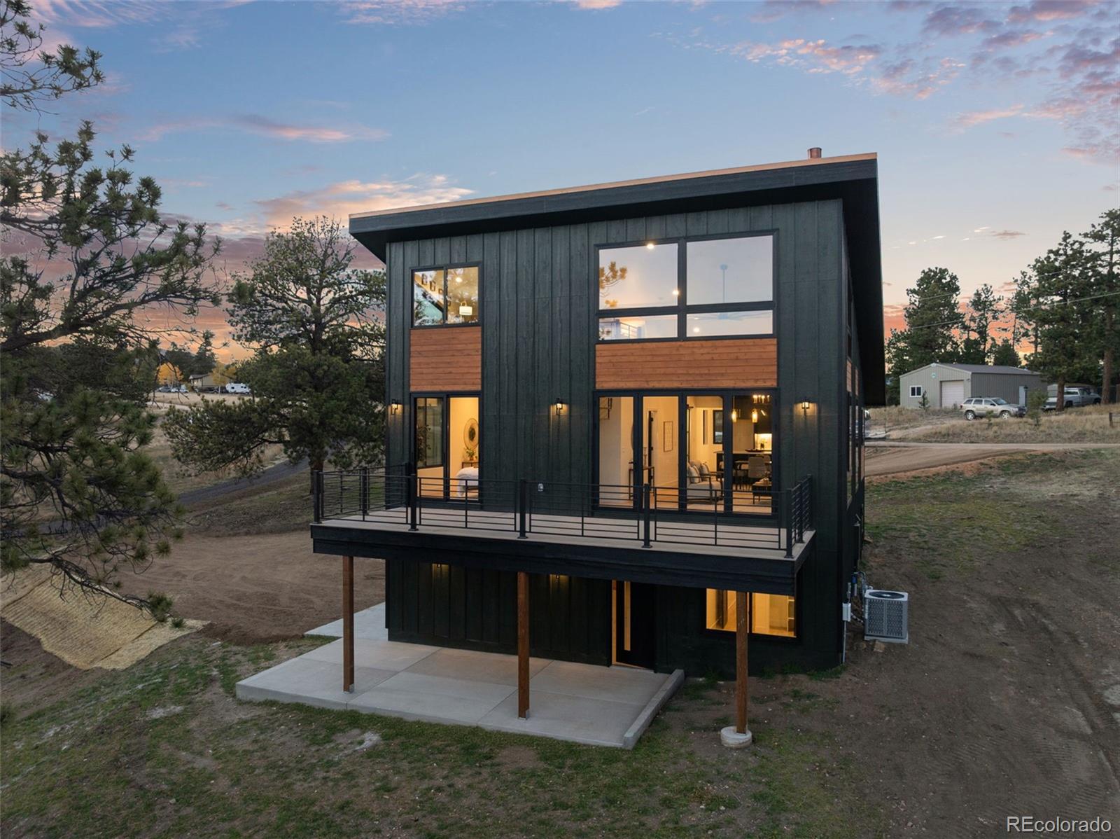 542 Conifer Drive Bailey, CO 80421 - Photo 6 of 47 a view of a house with backyard porch and sitting area