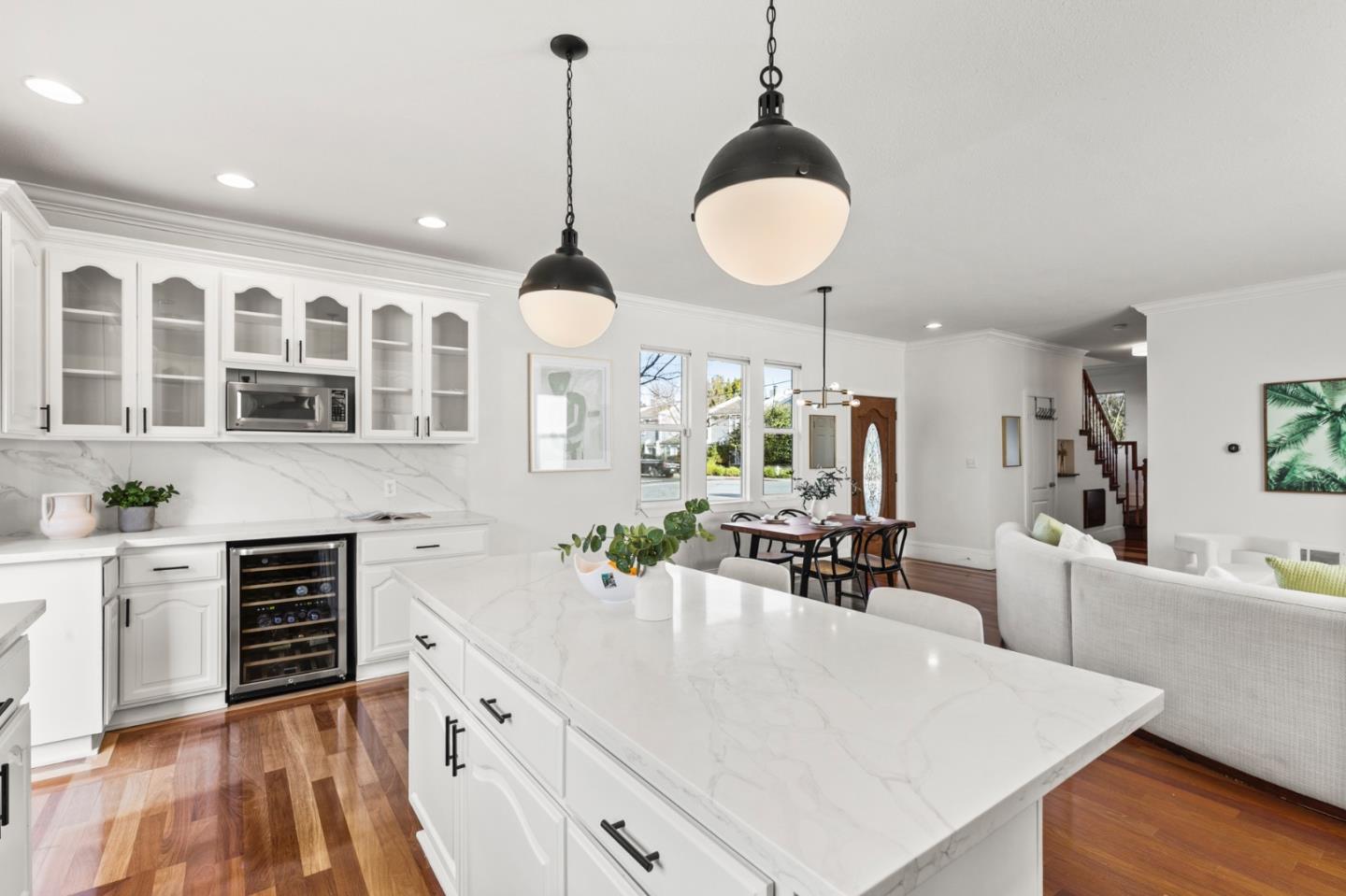 1095 Wright Avenue Mountain View, CA 94043 - Photo 13 of 29 a large kitchen with stainless steel appliances a large center island attached withe living room