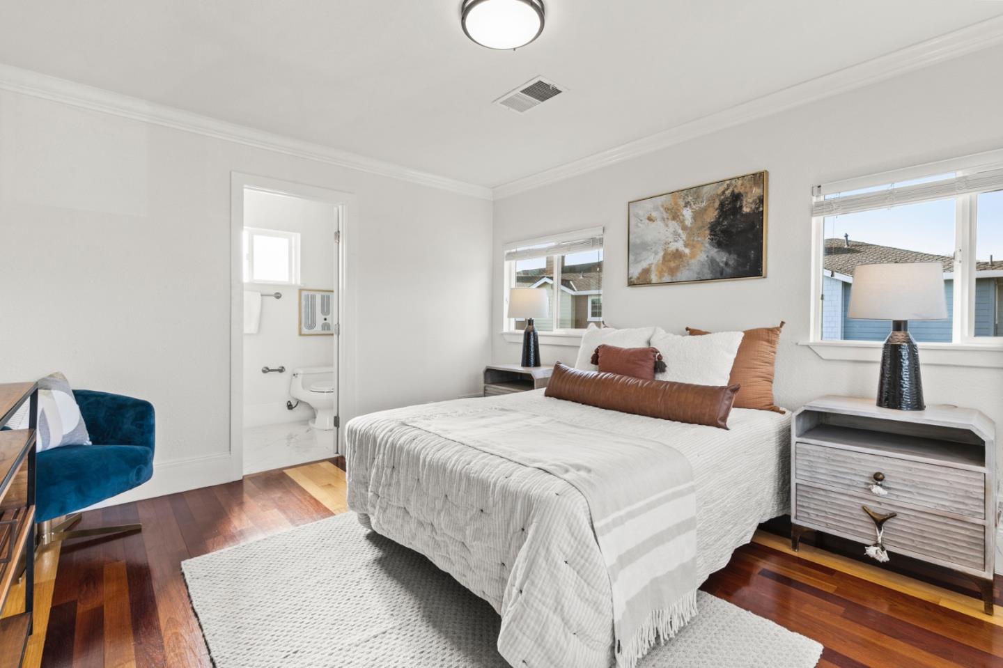 1095 Wright Avenue Mountain View, CA 94043 - Photo 15 of 29 a bedroom with a bed and wooden floor