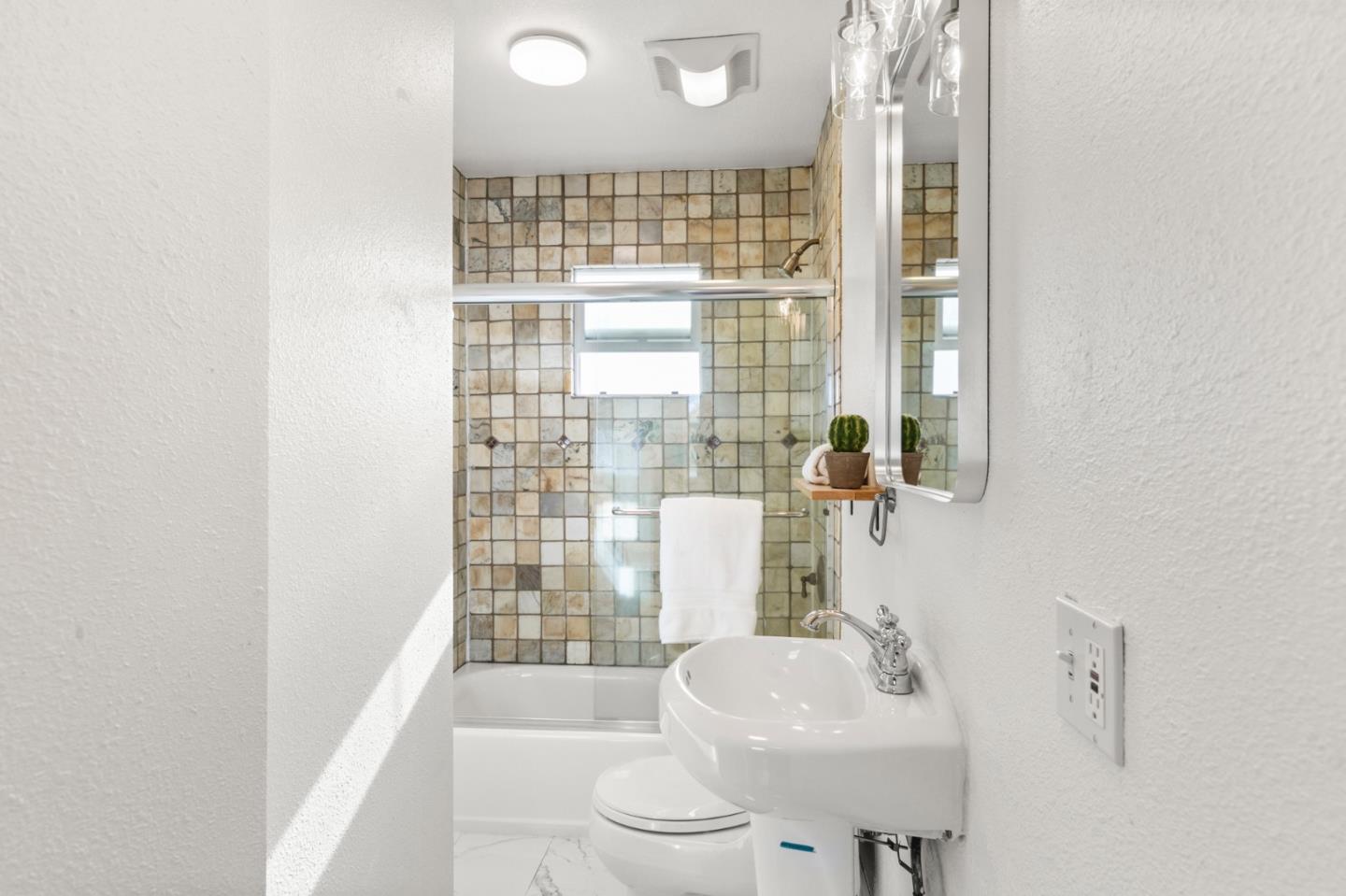 1095 Wright Avenue Mountain View, CA 94043 - Photo 22 of 29 a bathroom with a sink toilet and shower