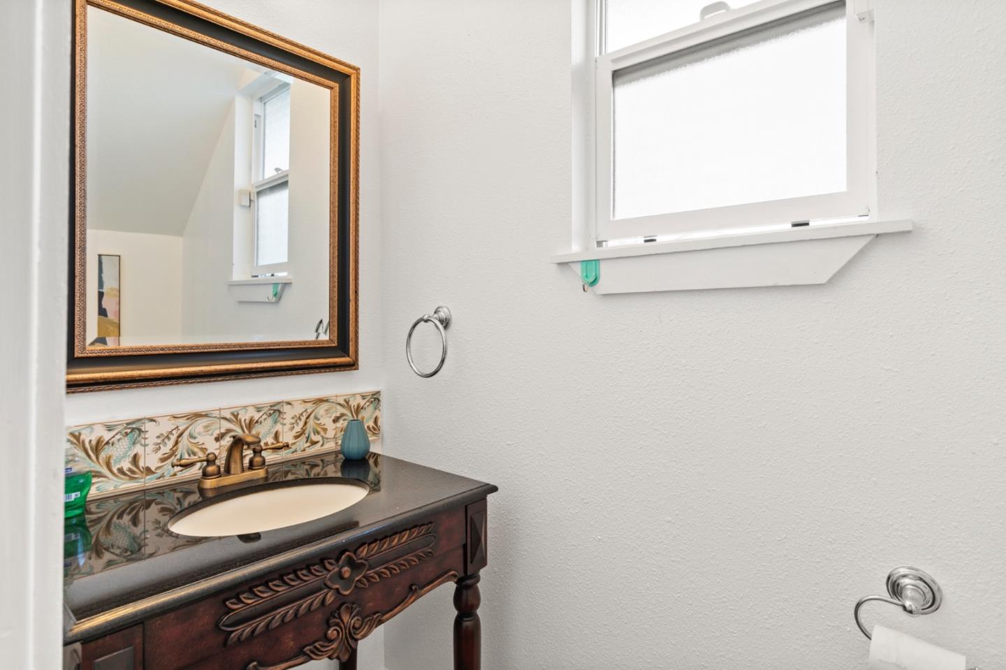 1095 Wright Avenue Mountain View, CA 94043 - Photo 25 of 29 a bathroom with a sink and a mirror