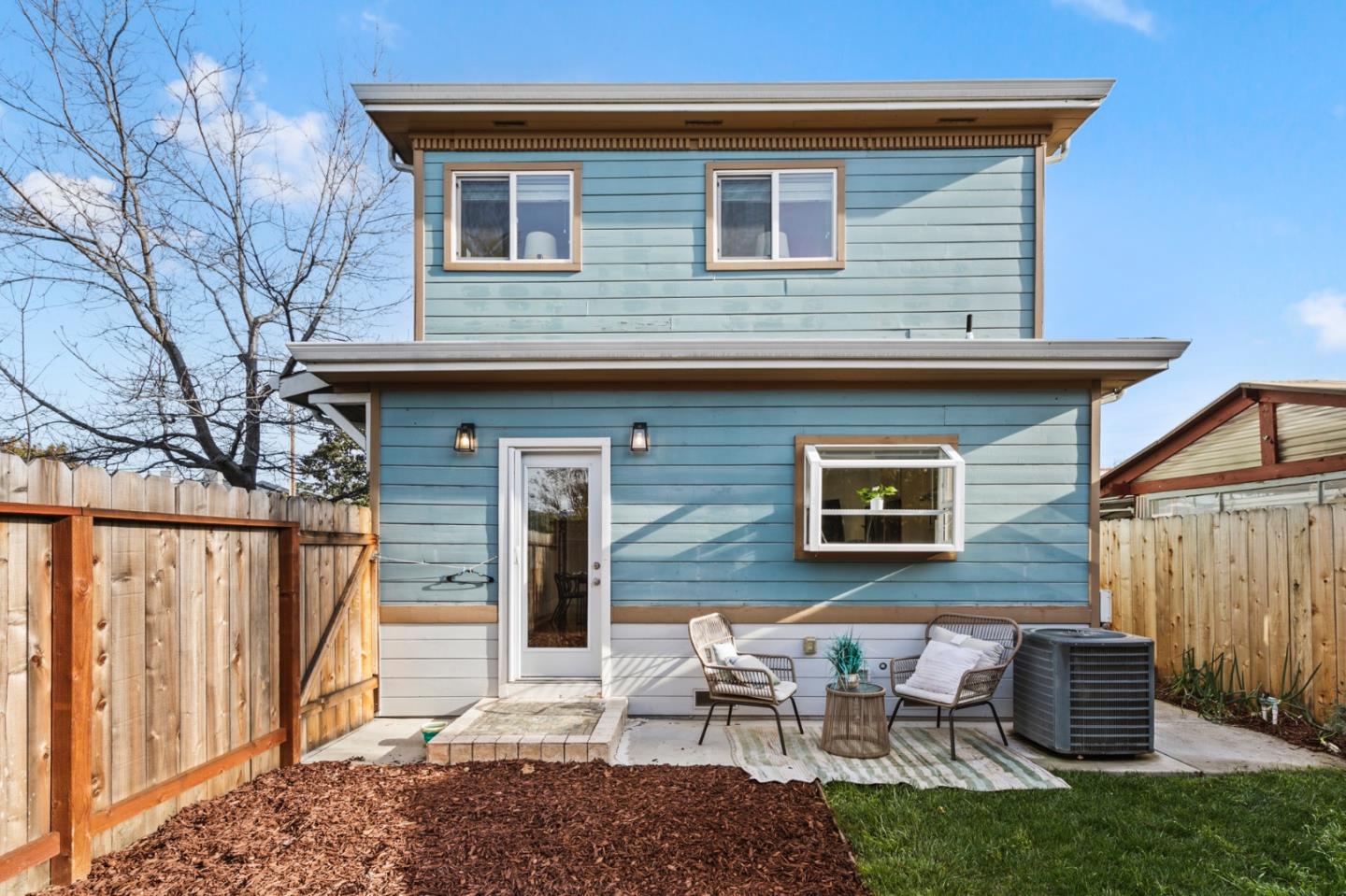 1095 Wright Avenue Mountain View, CA 94043 - Photo 28 of 29 a backyard of a house with table and chairs