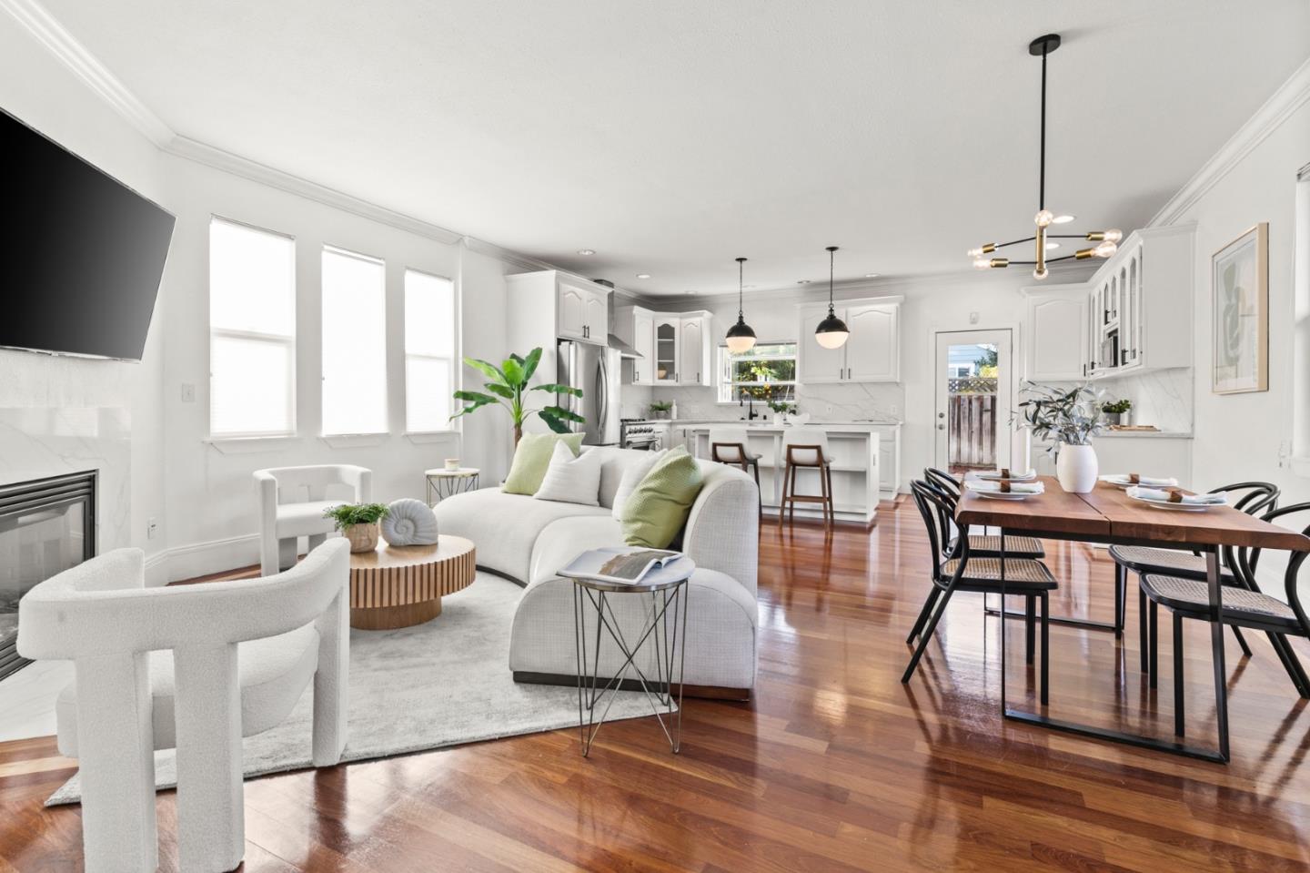 1095 Wright Avenue Mountain View, CA 94043 - Photo 4 of 29 a living room with lots of furniture and a flat screen tv