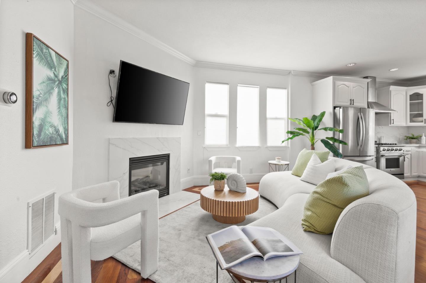 1095 Wright Avenue Mountain View, CA 94043 - Photo 5 of 29 a living room with furniture a fireplace and a flat screen tv