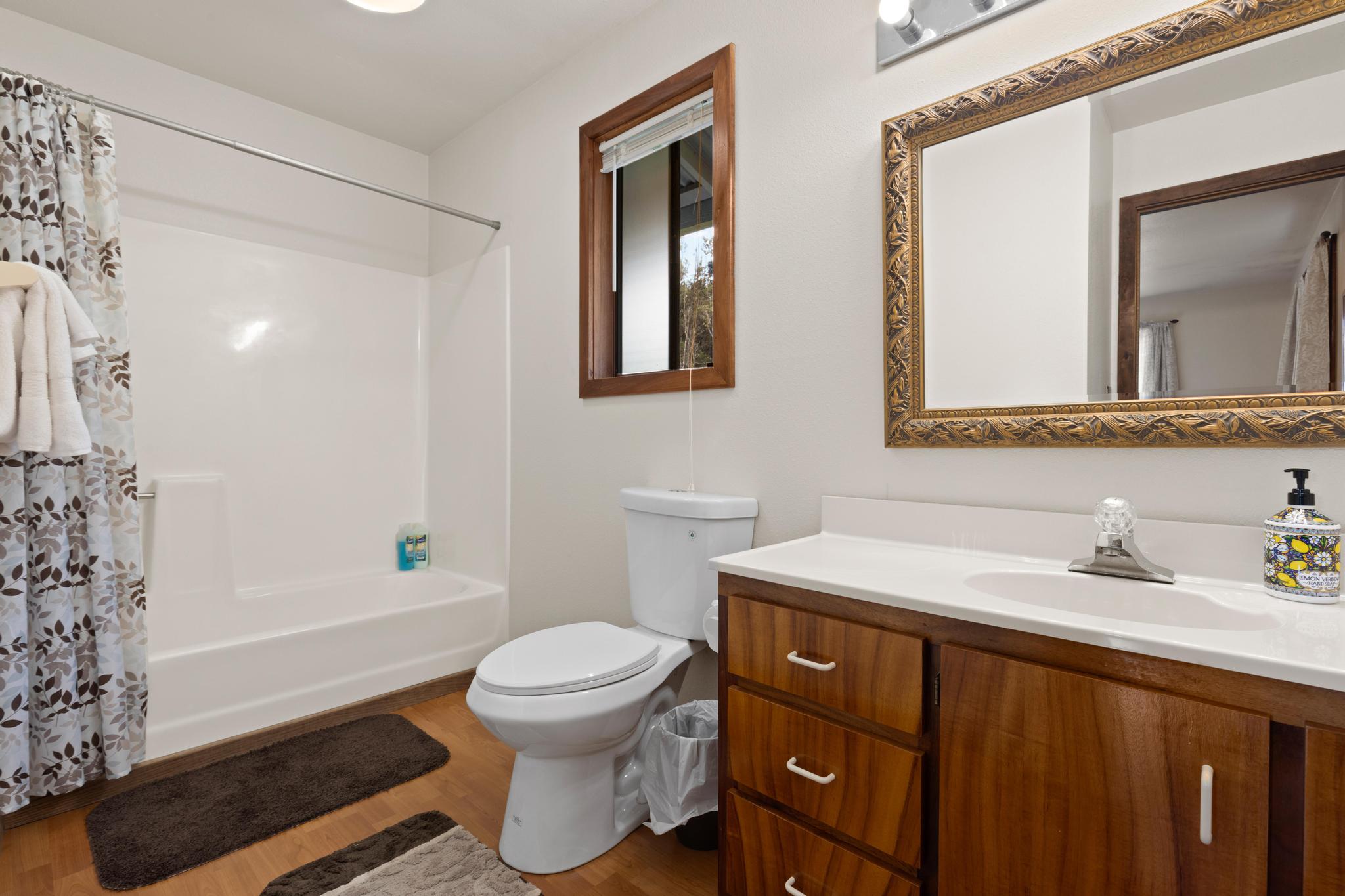 99-1817 Painiu Loop Volcano, HI 96785 - Photo 13 of 30 a bathroom with a sink toilet and shower