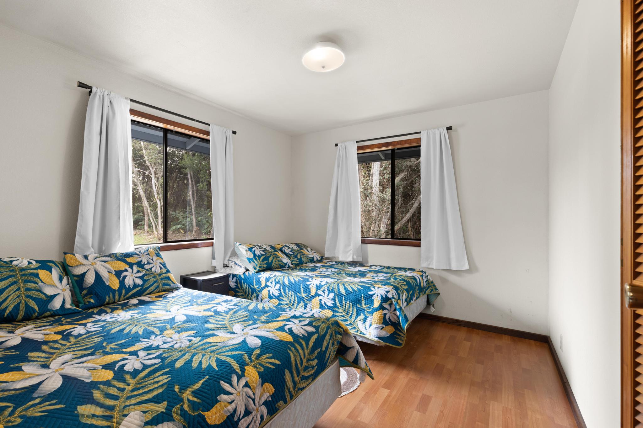 99-1817 Painiu Loop Volcano, HI 96785 - Photo 16 of 30 a bedroom with bed and a window