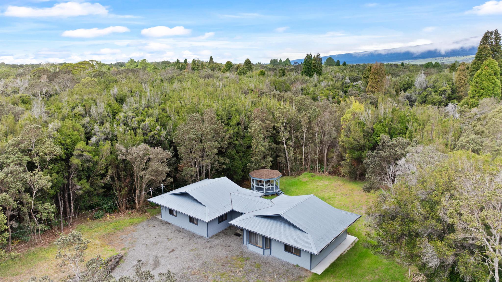 99-1817 Painiu Loop Volcano, HI 96785 - Photo 2 of 30 a view of a yard with furniture