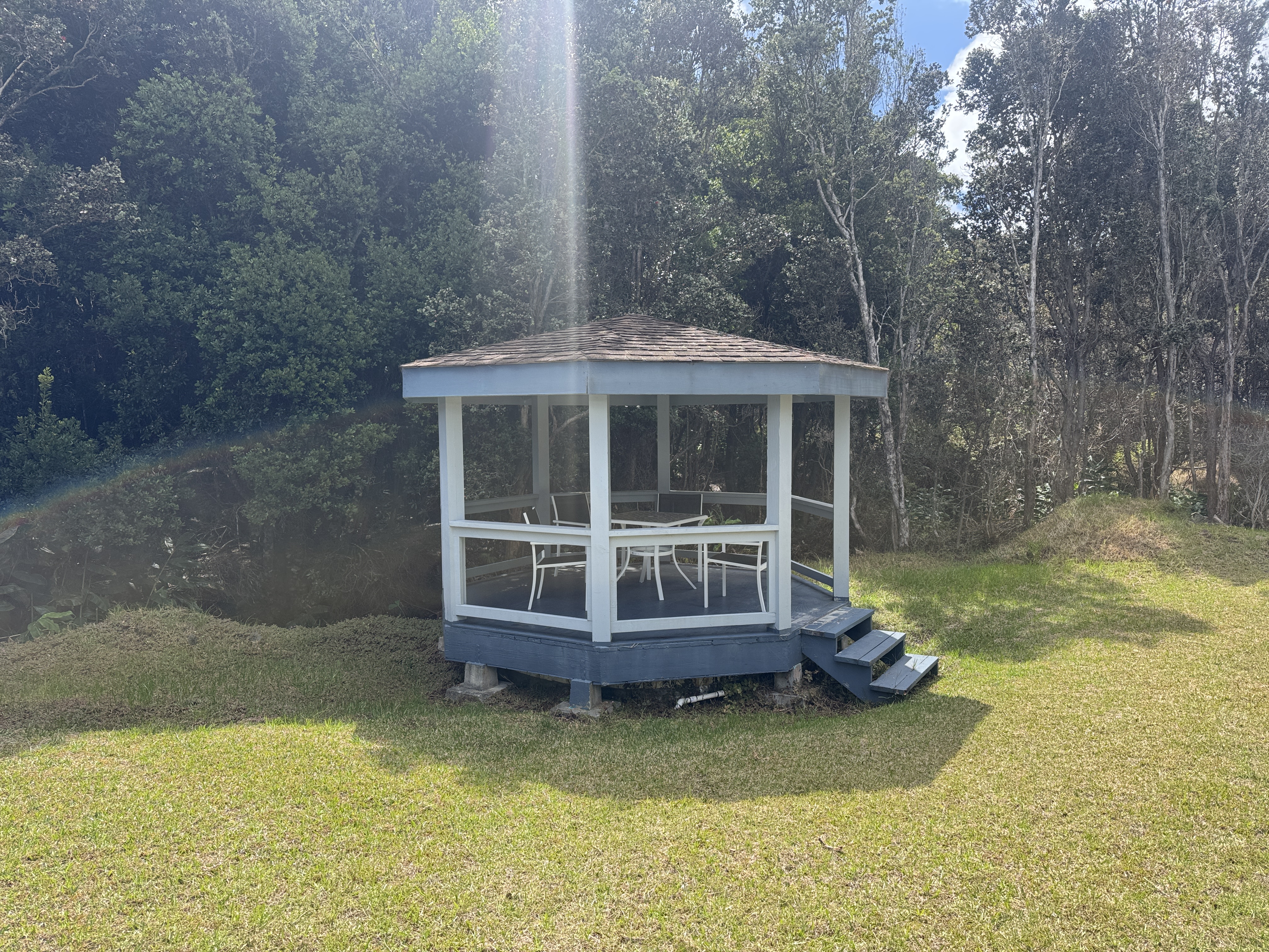 99-1817 Painiu Loop Volcano, HI 96785 - Photo 21 of 30 a view of a house with swimming pool and sitting area