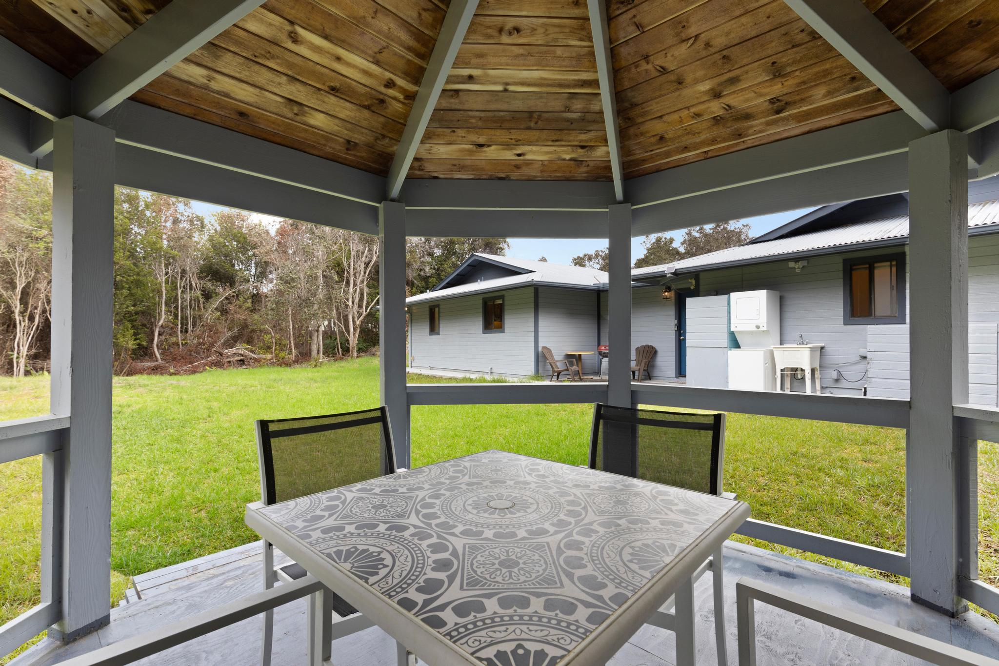 99-1817 Painiu Loop Volcano, HI 96785 - Photo 22 of 30 a view of a patio with table and chairs