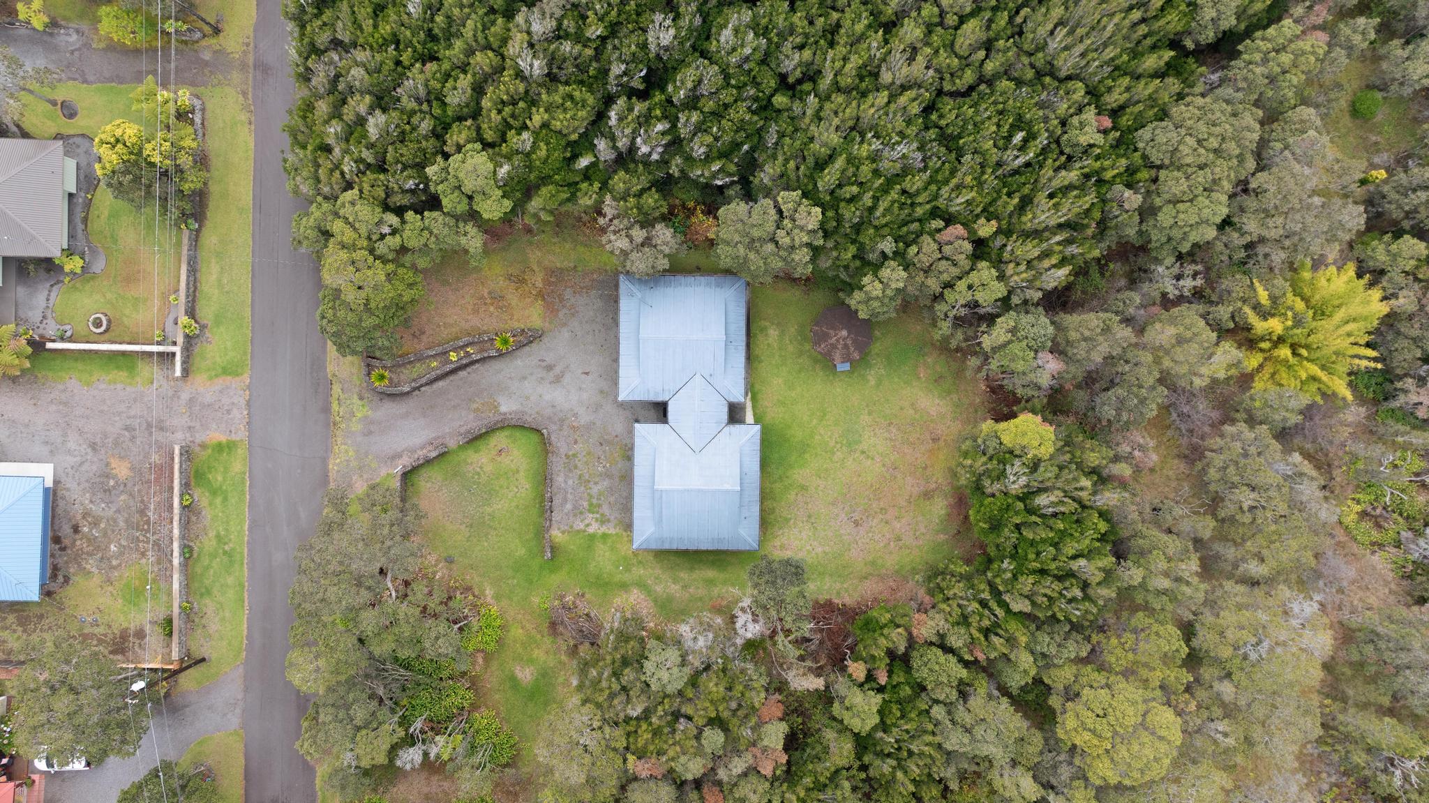 99-1817 Painiu Loop Volcano, HI 96785 - Photo 25 of 30 front view of a house with a plants