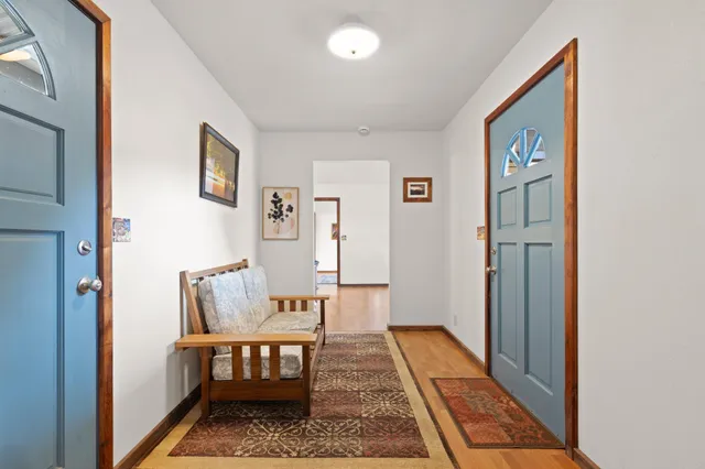 a dinning room with a table and chairs