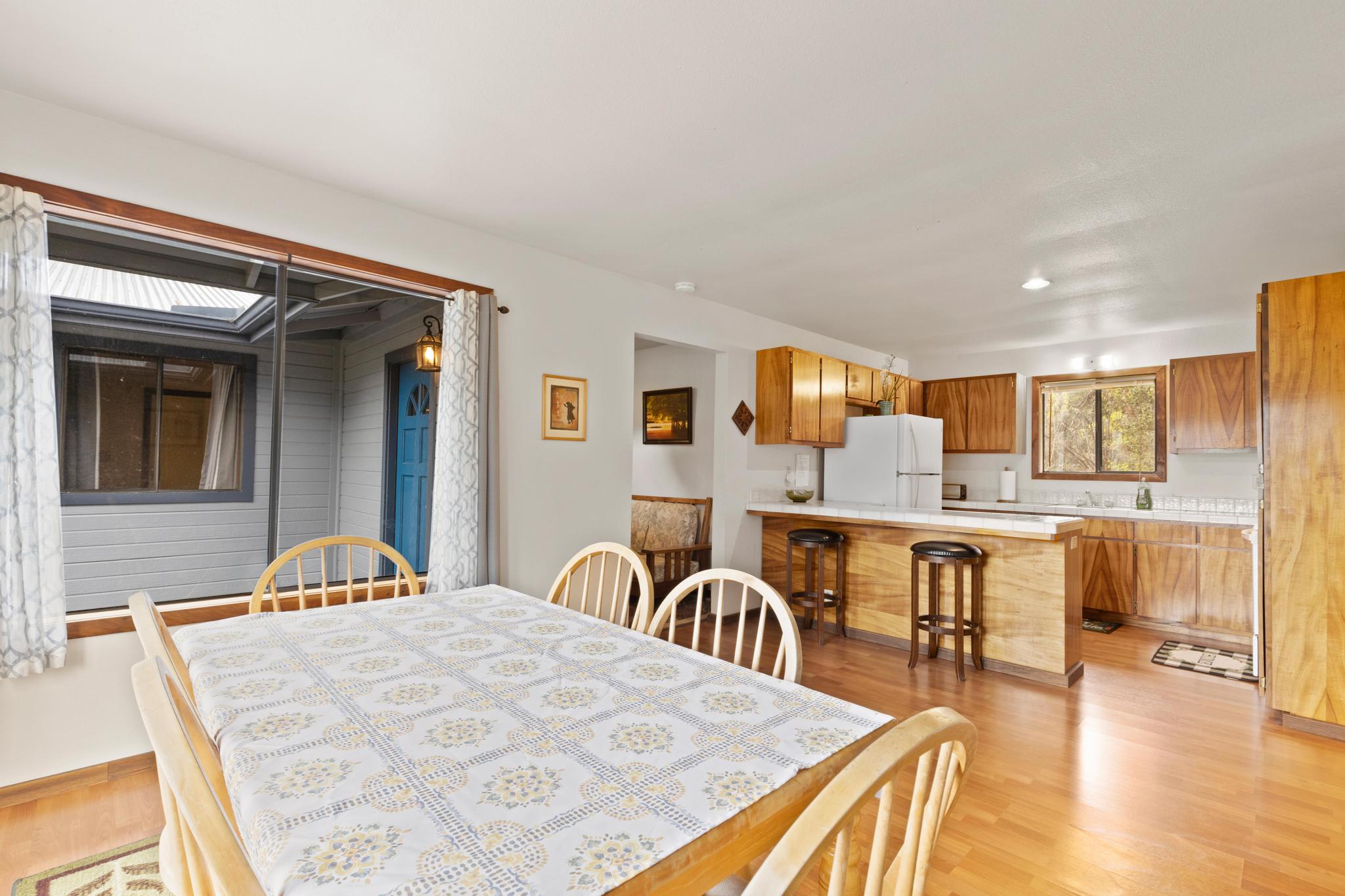 99-1817 Painiu Loop Volcano, HI 96785 - Photo 4 of 30 a dinning room with a table and chairs