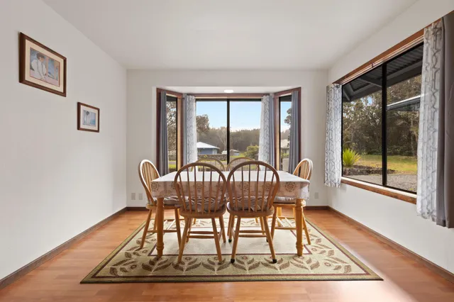 a bedroom with a bed a table and chair