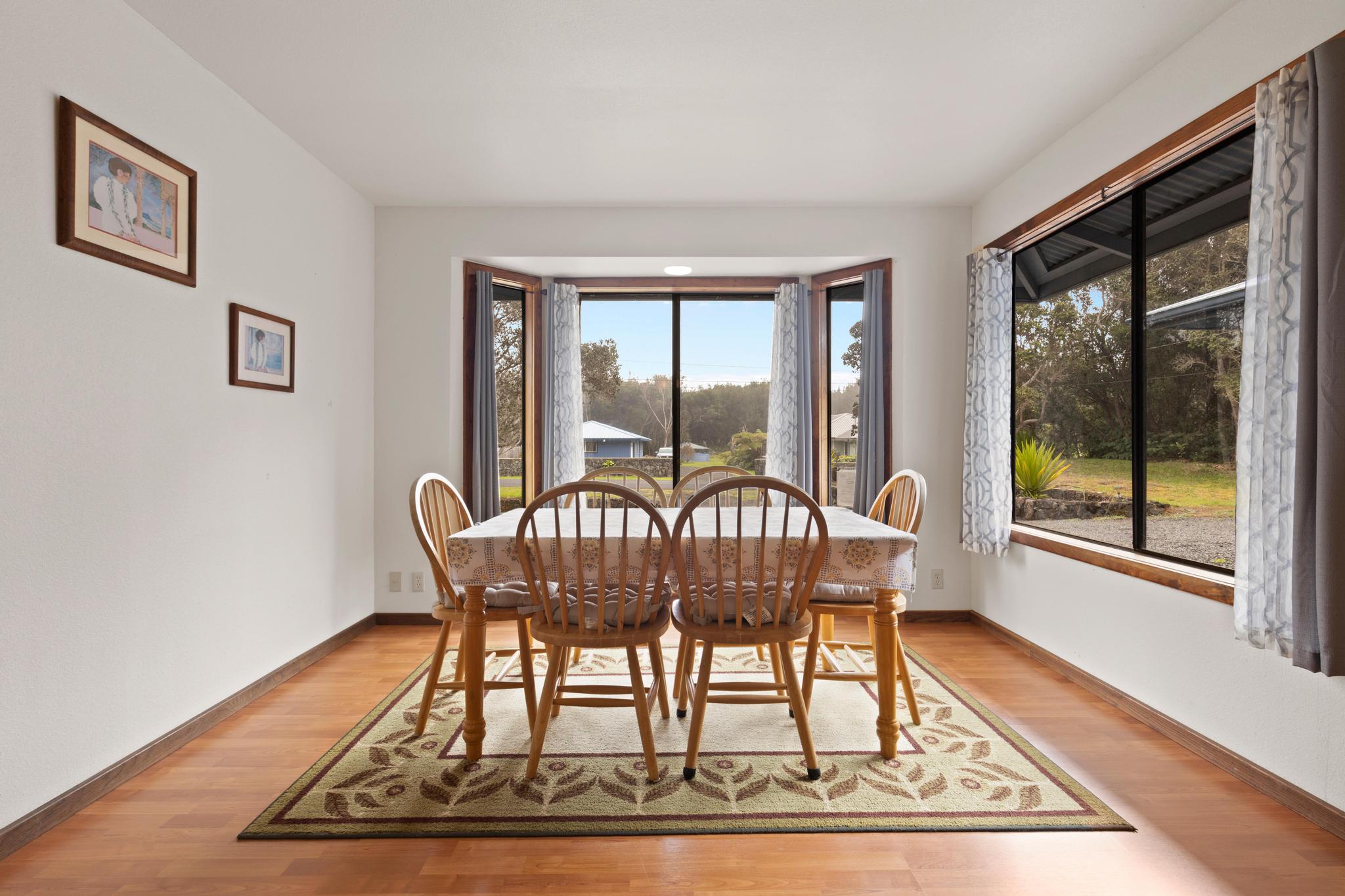 99-1817 Painiu Loop Volcano, HI 96785 - Photo 5 of 30 a view of a workspace with furniture window and wooden floor
