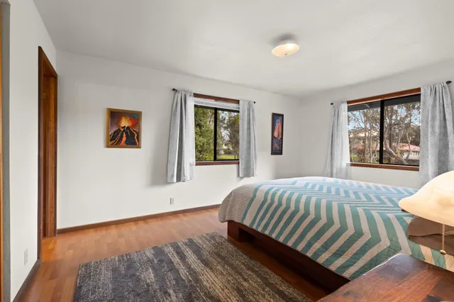 a bedroom with furniture and windows