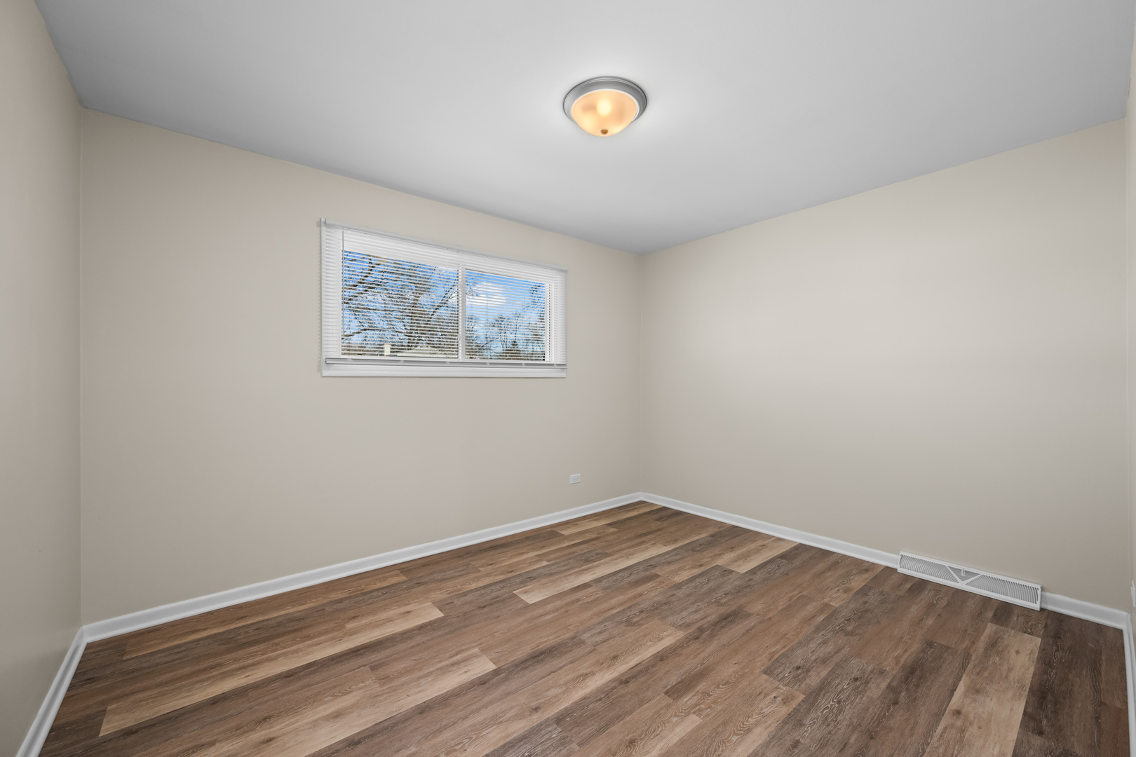 1917 Pawnee Lane Mount Prospect, IL 60056 - Photo 14 of 29 a view of empty room with wooden floor