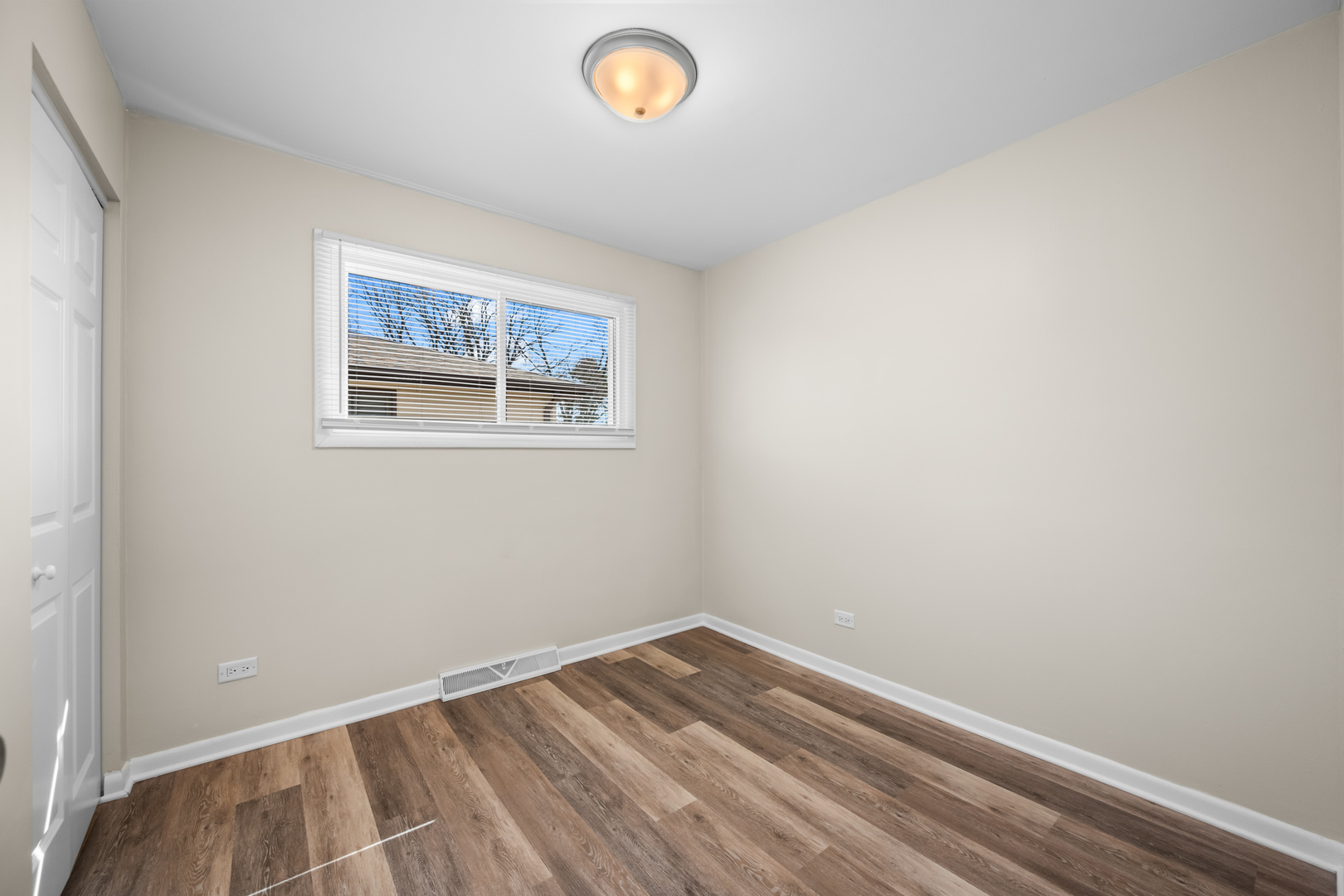 1917 Pawnee Lane Mount Prospect, IL 60056 - Photo 15 of 29 an empty room with a window
