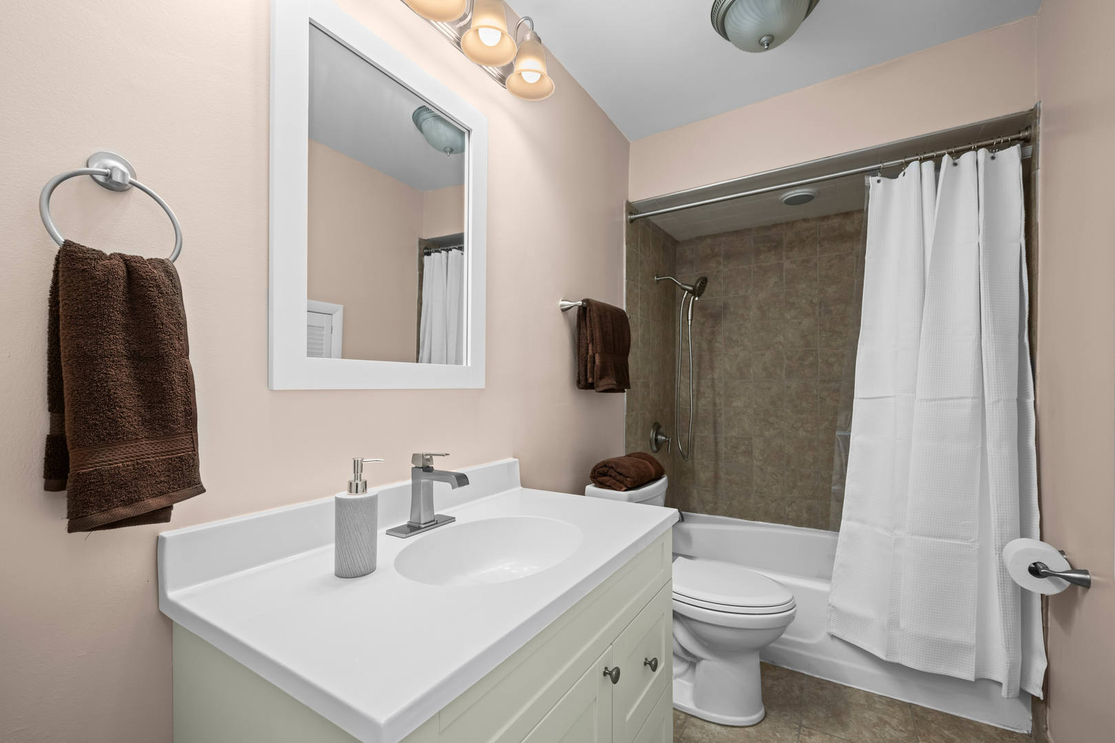 1917 Pawnee Lane Mount Prospect, IL 60056 - Photo 16 of 29 a bathroom with a sink a toilet and shower