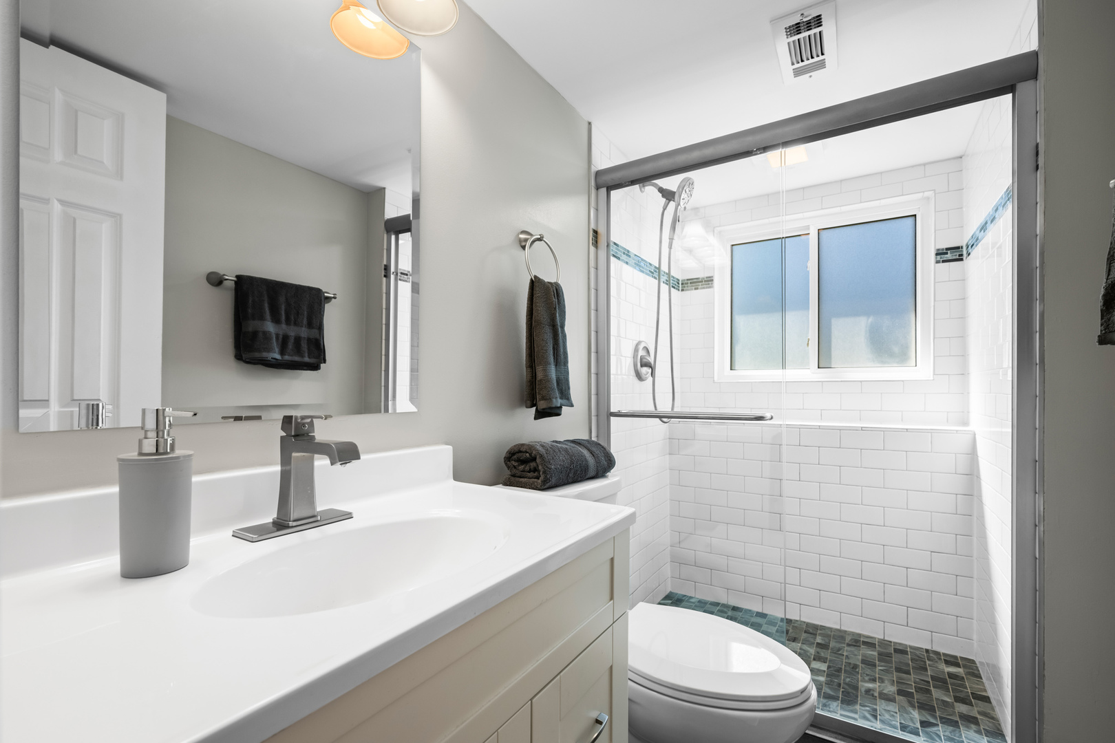 1917 Pawnee Lane Mount Prospect, IL 60056 - Photo 20 of 29 a bathroom with a sink a toilet a mirror and shower