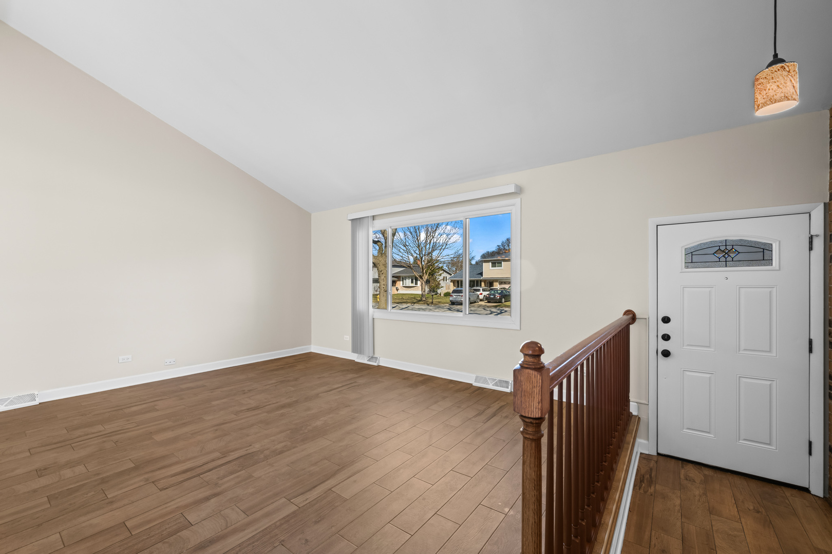 1917 Pawnee Lane Mount Prospect, IL 60056 - Photo 2 of 29 a view of a hallway with wooden floor and workspace