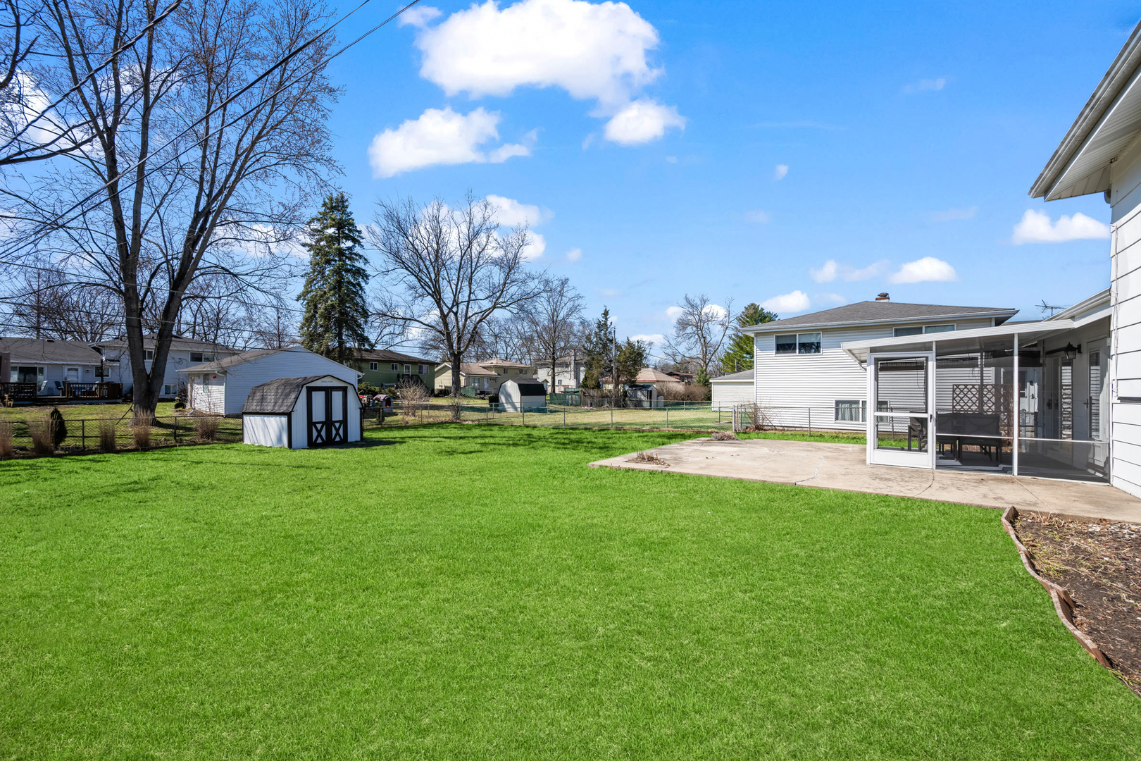 1917 Pawnee Lane Mount Prospect, IL 60056 - Photo 23 of 29 a front view of a house with a yard and trees