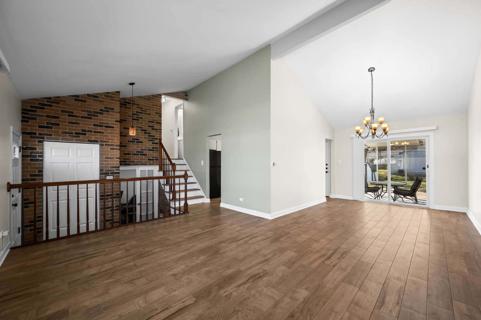 1917 Pawnee Lane Mount Prospect, IL 60056 - Photo 4 of 29 an empty room with wooden floor and windows