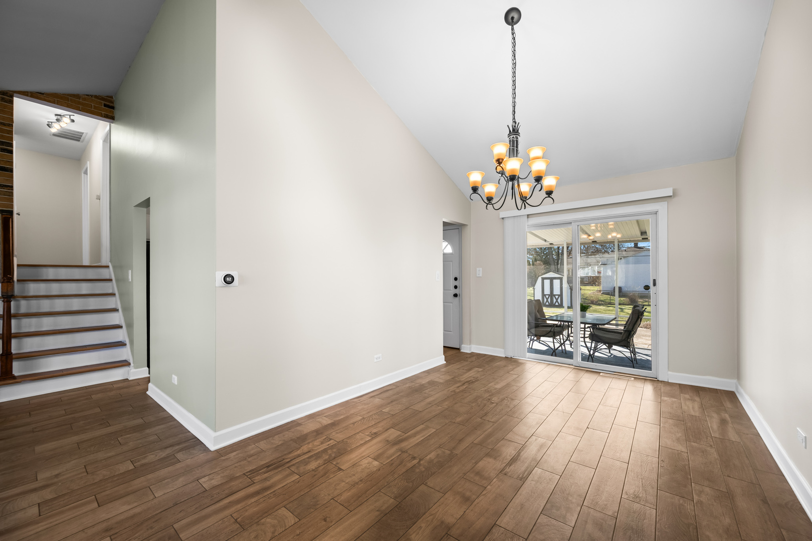 1917 Pawnee Lane Mount Prospect, IL 60056 - Photo 5 of 29 a dining room with chandelier and wooden floor