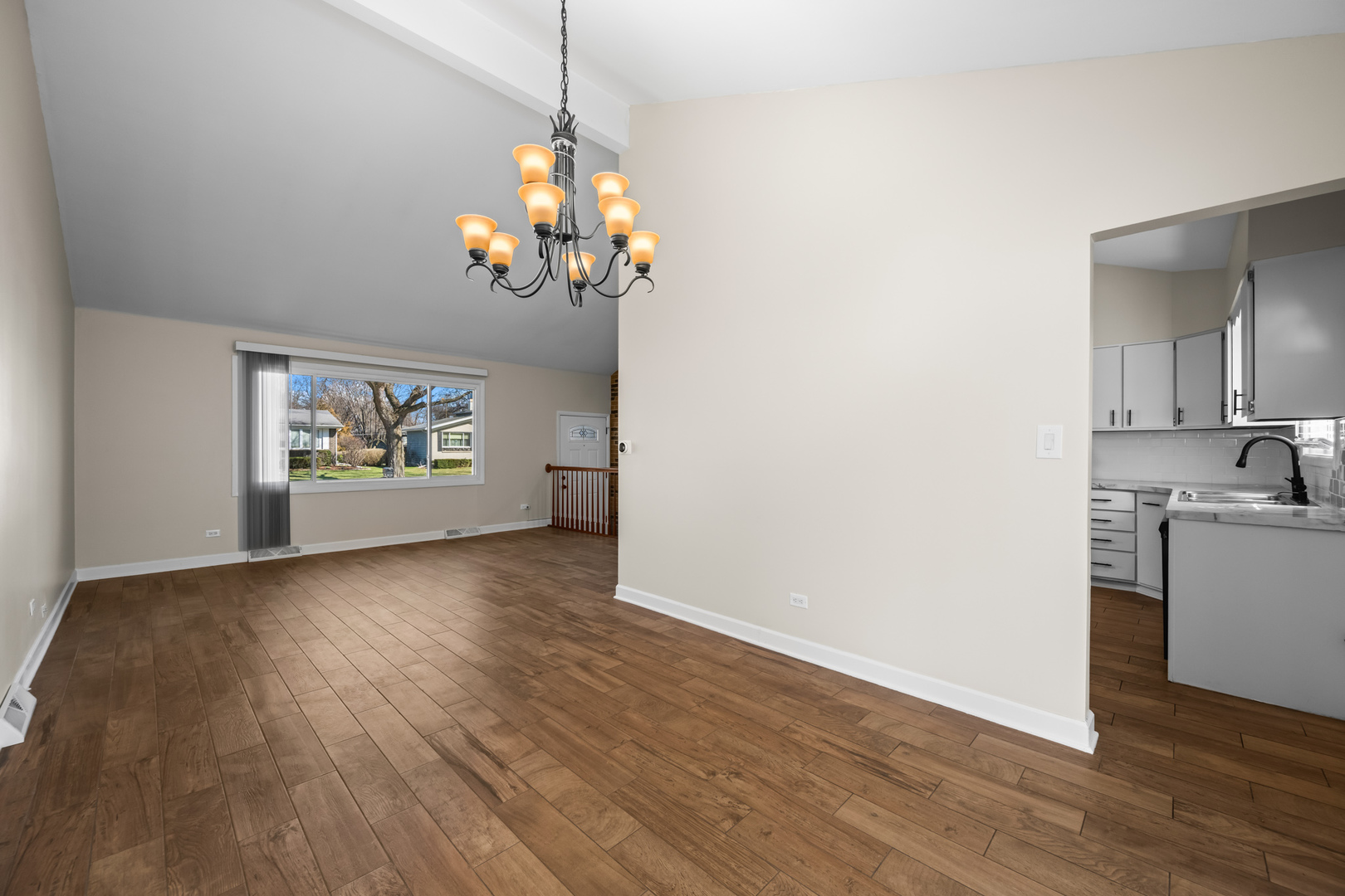 1917 Pawnee Lane Mount Prospect, IL 60056 - Photo 6 of 29 a view of a room with wooden floor stove and kitchen view