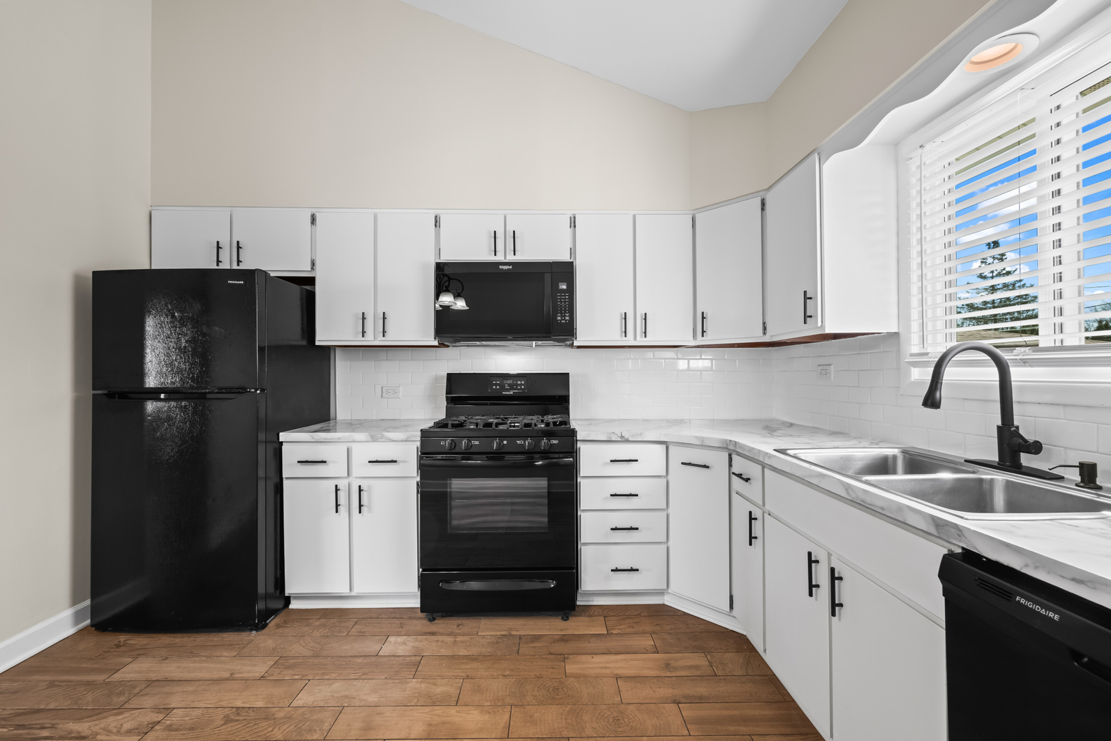 1917 Pawnee Lane Mount Prospect, IL 60056 - Photo 8 of 29 a kitchen with stainless steel appliances granite countertop a refrigerator stove and sink