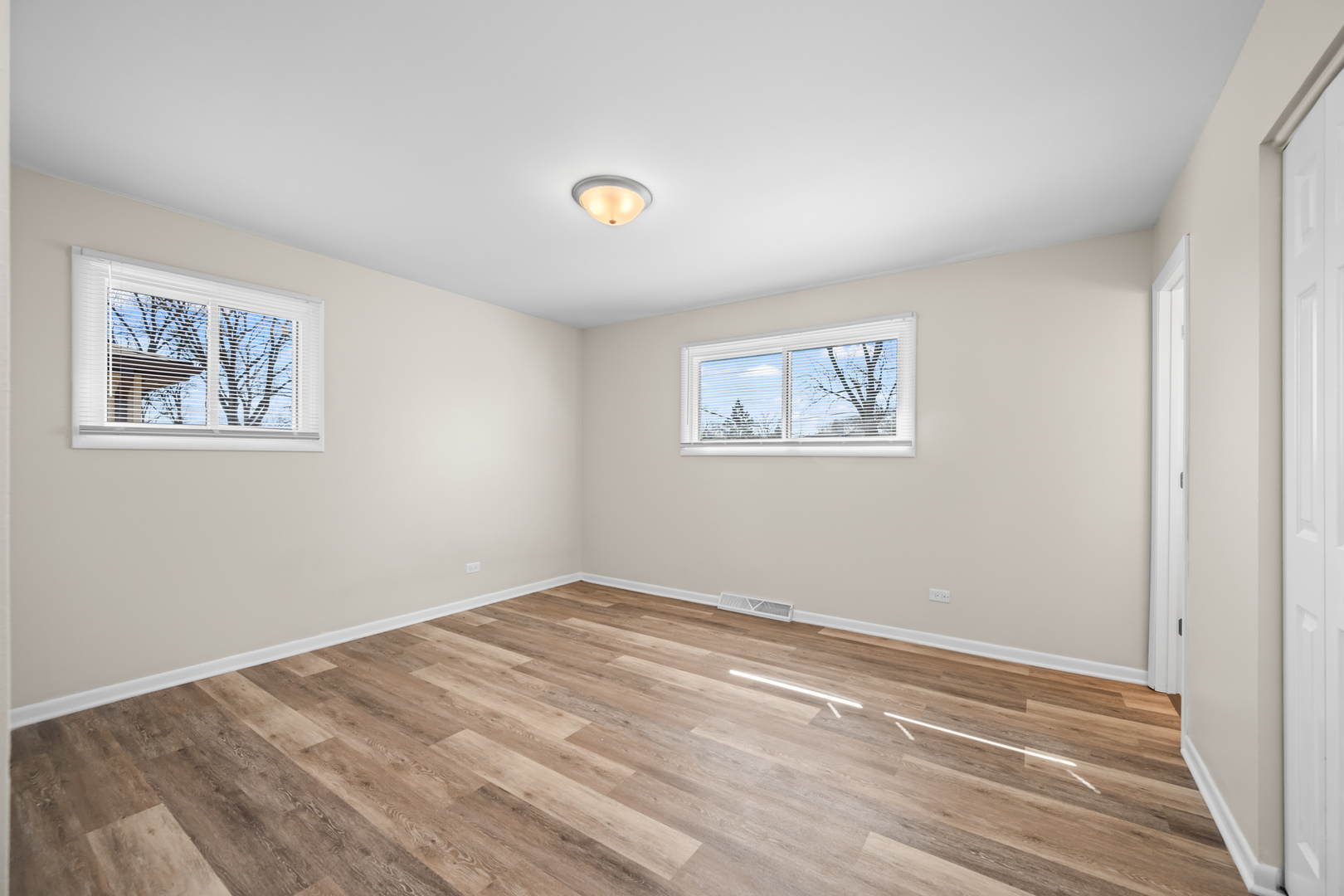 1917 Pawnee Lane Mount Prospect, IL 60056 - Photo 10 of 29 a view of empty room with wooden floor