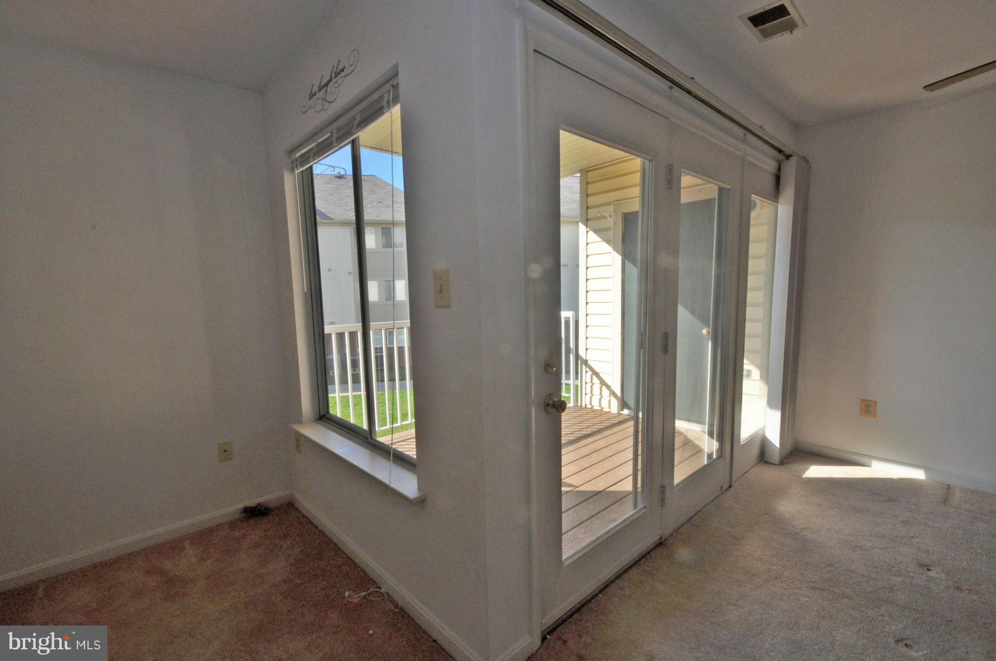 2104 Whitehall Road, Unit 1C Frederick, MD 21702 - Photo 8 of 24 Large 9' Atrium door to outside deck
