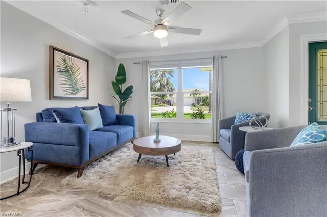 a living room with a couch and a large window