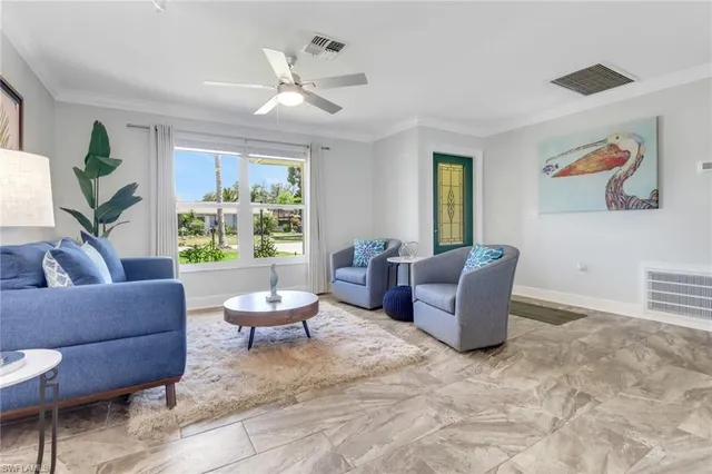 a living room with furniture and window