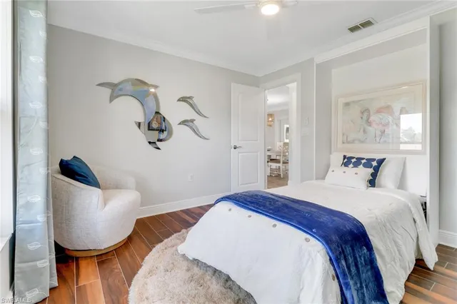 a bedroom with bed and a chair