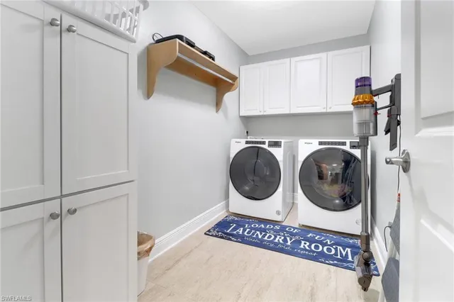 a view of a hallway with washer and dryer
